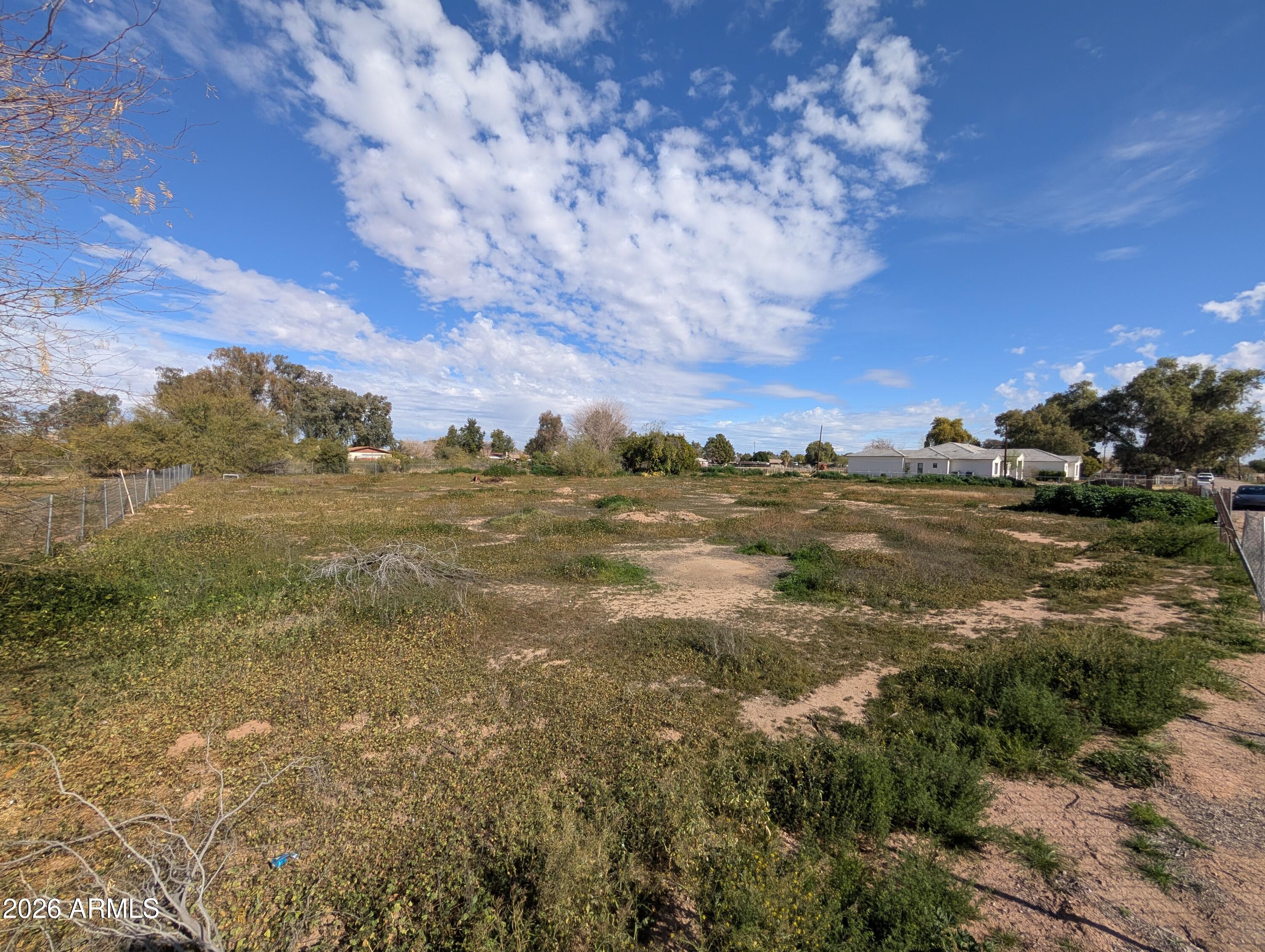 Nearly square 1.18 acre lot w/ mature citrus trees & irrigation on private street.  Water & Electric are already at the lot.  Sewer believed to be in the road but not yet connected.  Lot is situated North/South orientation.  No HOA.  Highly ranked Chandler School District.