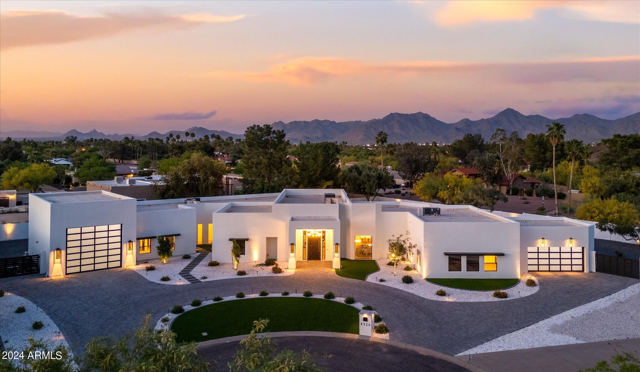 Welcome home to this stunning remodel nestled in central Scottsdale sitting on nearly an acre lot with no HOA constraints, large RV garage (40' x 20'), and side RV gate. This home features 5 bedrooms, 5 bathrooms, an office, theater room, and an open concept kitchen / living room with expansive glass sliding doors leading to the covered patio and backyard for true indoor-outdoor living. Entertain guests in the backyard with a sunken bar / Ramada off the pool with swim up seating and modern fireplace with generous seating. The kitchen is light and bright with a large waterfall sit-up island paired with top-of-the-line Wolff and Sub Zero appliances featuring double gas range, side by side refrigerator and freezer, wine cooler, and with a secondary prep kitchen open to the formal dining room The large primary suite features walls of glass providing natural light, an oversized walk-in shower, pedestal tub, and walk-in closet. Whole home is pre-wired for AV, ensuring entertainment at your fingertips throughout every corner of the house! The backyard is large enough to add a detached casita should you want to expand. Enjoy Arizona living in this conveniently located home in the heart of Scottsdale, close to shopping, dining, golf courses, and HWY 101!