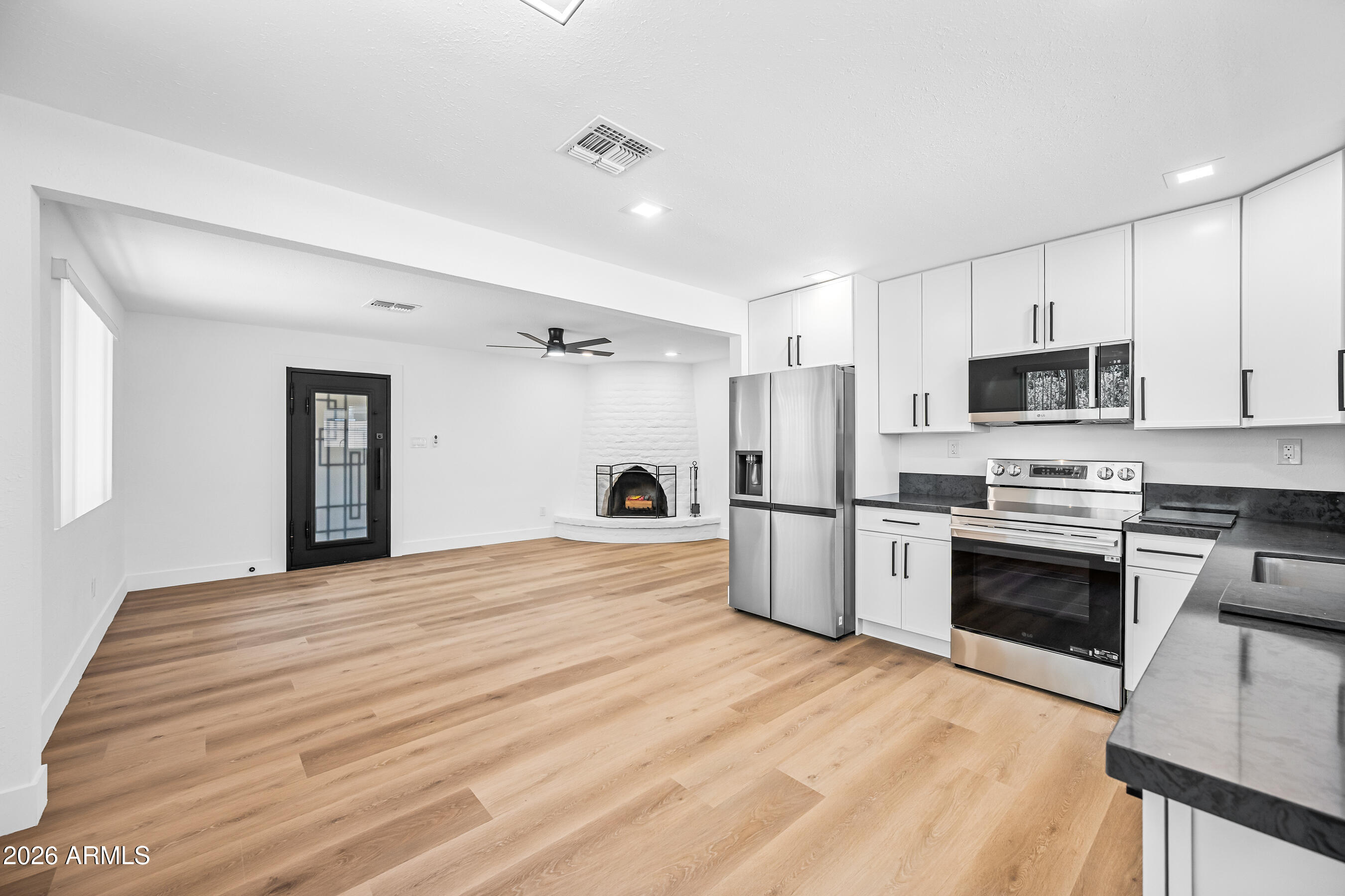 Beautifully updated 2bed, 1bath first-floor apartment home located in the desirable Biltmore/Arcadia area. This move-in ready residence features a completely renovated kitchen with quartz countertops, new cabinetry, new appliances, and updated fixtures throughout. Enjoy new flooring, energy-efficient windows, a new A/C system, and the convenience of an in-unit washer and dryer. Spacious living areas offer comfort and functionality, while the central location provides easy access to dining, shopping, entertainment, and major commuter routes. Experience modern living in one of Phoenix's most sought-after neighborhoods.