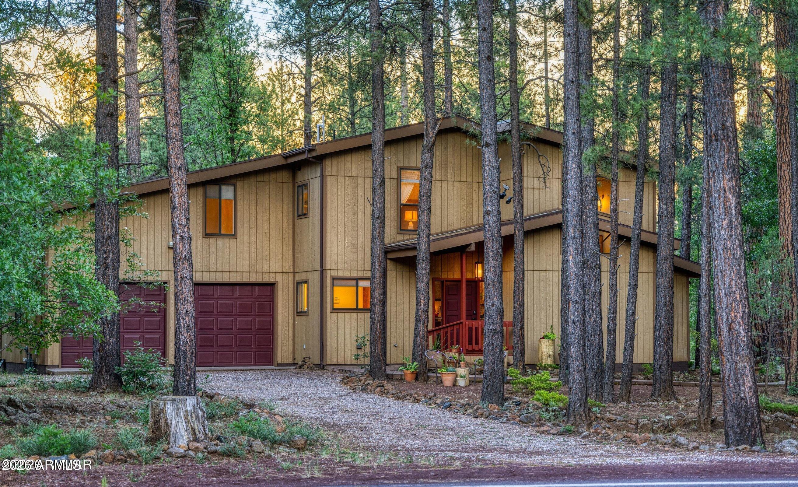 Step into a fairytale at 8727 Country Club Dr., where every sunrise feels enchanted, and every season tells a new story. Offered for the very first time, this extraordinary mountain retreat feels worlds away from the hustle of everyday life, yet it's just minutes from the shops, restaurants, golf, and amenities of Pinetop. Bordering nearly 48,000 acres of National Forest and more than 500,000 acres of Reservation land, your backyard becomes a living storybook. Watch wild horses gracefully wander through the meadow; elk emerge from the forest at dusk, and deer quietly pass by beneath towering pines. From the private balcony off the primary suite, sip your morning coffee as snowflakes gently drift from the sky, transforming the landscape into a sparkling winter wonderland. Inside, a thoughtfully designed floor plan offers the perfect blend of comfort and flexibility for every season of life. The expansive loft is ready to become whatever your story calls for--a cozy library, game room, home office, artist studio, or a magical retreat where family and friends gather after days spent exploring the mountains. Whether you're hosting unforgettable holiday celebrations, escaping the summer heat, or settling in for peaceful winter weekends, this home effortlessly adapts to every chapter.

Here, each season brings its own kind of wonder. Spring awakens the forest with new life; summers are filled with cool mountain breezes and birdsong, autumn paints the landscape in brilliant shades of gold, and winter wraps the home in a quiet blanket of snow. This is more than a home; it's a place where memories are written, adventures begin, and a little bit of magic lives every day.
