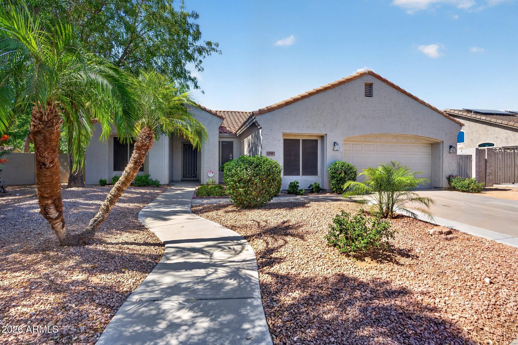 Just minutes from Downtown Gilbert, this gorgeous updated home sits on a larger lot with a sparkling pool, lush green lawn, and mature landscaping. The open-concept floor plan is perfect for everyday living and entertaining, while the split primary suite provides added privacy. A spacious bonus room off the kitchen is ideal for a craft room, home office, gym, media room, or future bedroom. Major updates include a NEW roof (2023), NEW A/C compressor (2024), whole-home PEX plumbing repipe (2025), NEW water heater (2025), and NEW water softener (2026). Close to Gilbert's popular dining, shopping, parks, and community events!