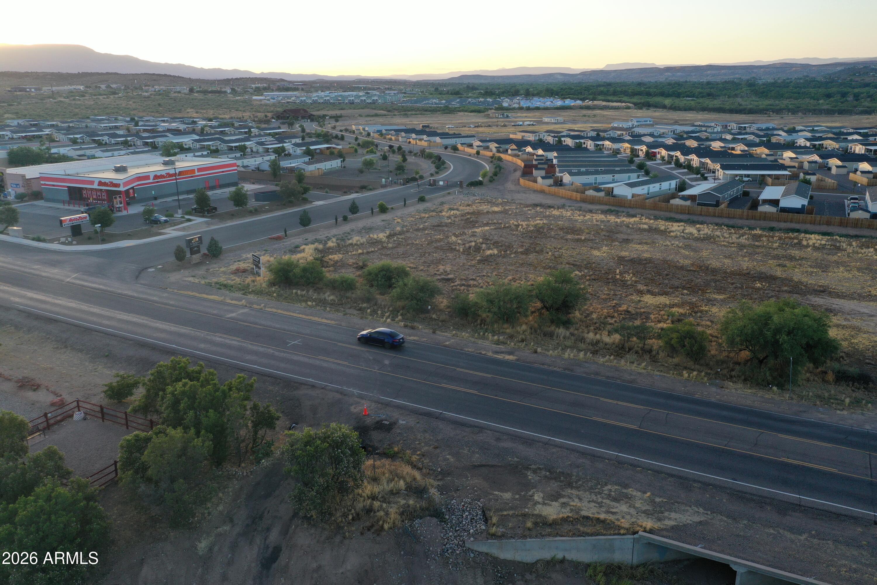 Hard to find, C2 zoned corner parcel on Finnie Flat Road, ready for your vision.