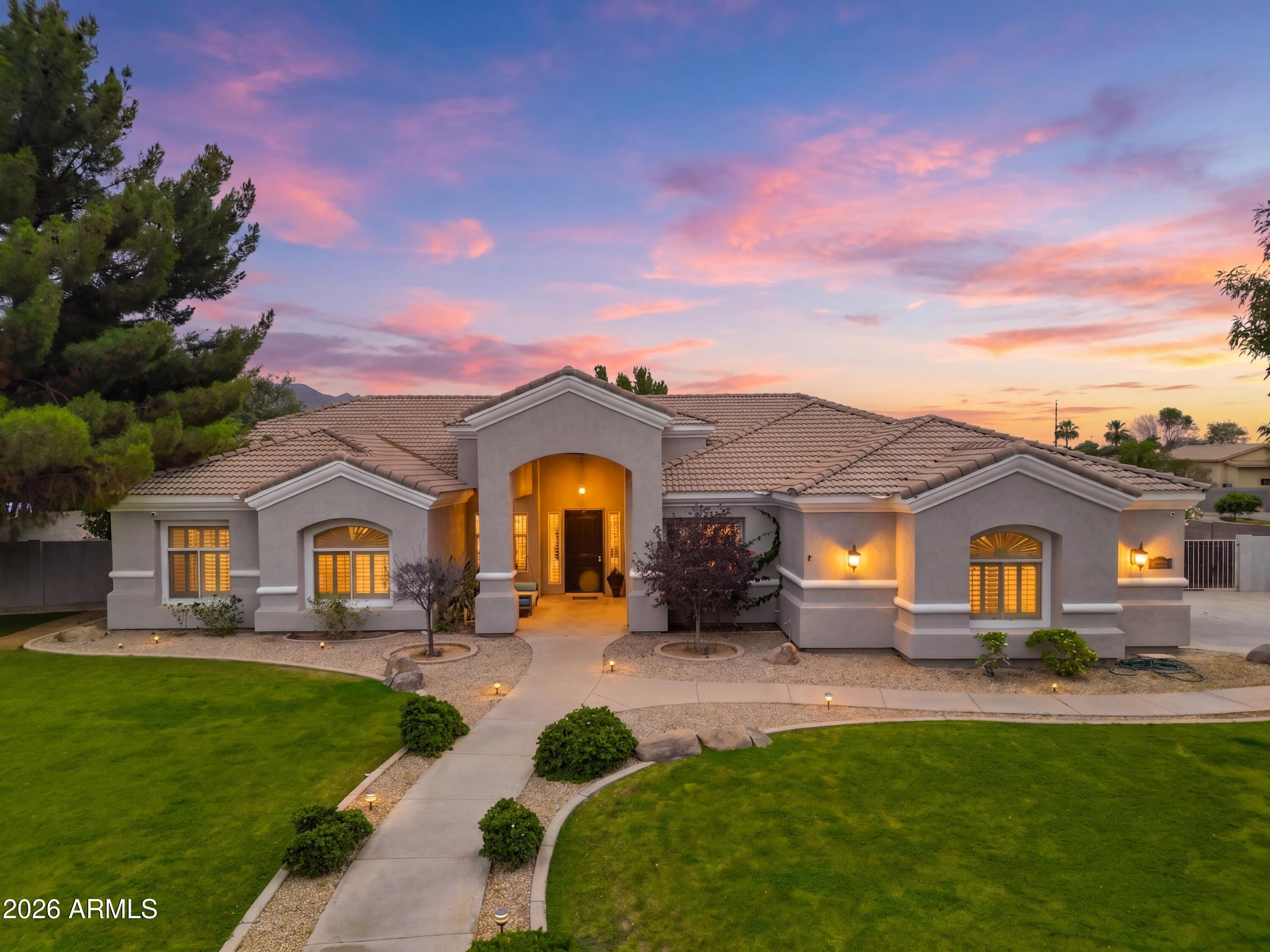 Welcome to Greenfield Acres a unique neighborhood in South Gilbert.  People fall in love with the charm of the tree-lined streets, acre lots, and the various styles of custom homes.  Each lot has horse privileges, and flood irrigation.  
This property is one you WON'T want to miss!  This single-level ranch style home offers 5 spacious bedrooms, 3 full bathrooms, and just under 3,500 sq.ft.  The open floor plan is inviting for entertaining, and has a modern feel!  You won't have to worry about carpet in this home, new luxury vinyl has been placed throughout the property.  The new exterior and interior paint provide you with a blank canvas to create your ideal home sweet home! As you step outside, you'll be welcomed by your very own outdoor retreat!  The sparkling pool, with a water slide and fountain has been newly updated, so this summer will provide endless memories in the making!  The large, covered patio offers a great meeting place, however you also have a lovely gazabo with an outdoor kitchen, pizza oven, grill, and refrigerator.  Right next to that, you have a propane fed firepit to enjoy as we head into cooler temperatures.  In addition you'll enjoy Lots of cozy custom seating areas, a custom white picket fenced off area for a garden, lovely stone footbridge and an area for a putting green make this backyard a fantastic entertainment offering.

With these large lots, you still have space to build an RV Garage, casita, or sport court!  A rare opportunity to own versatile property in one of Gilbert's most desirable communities.