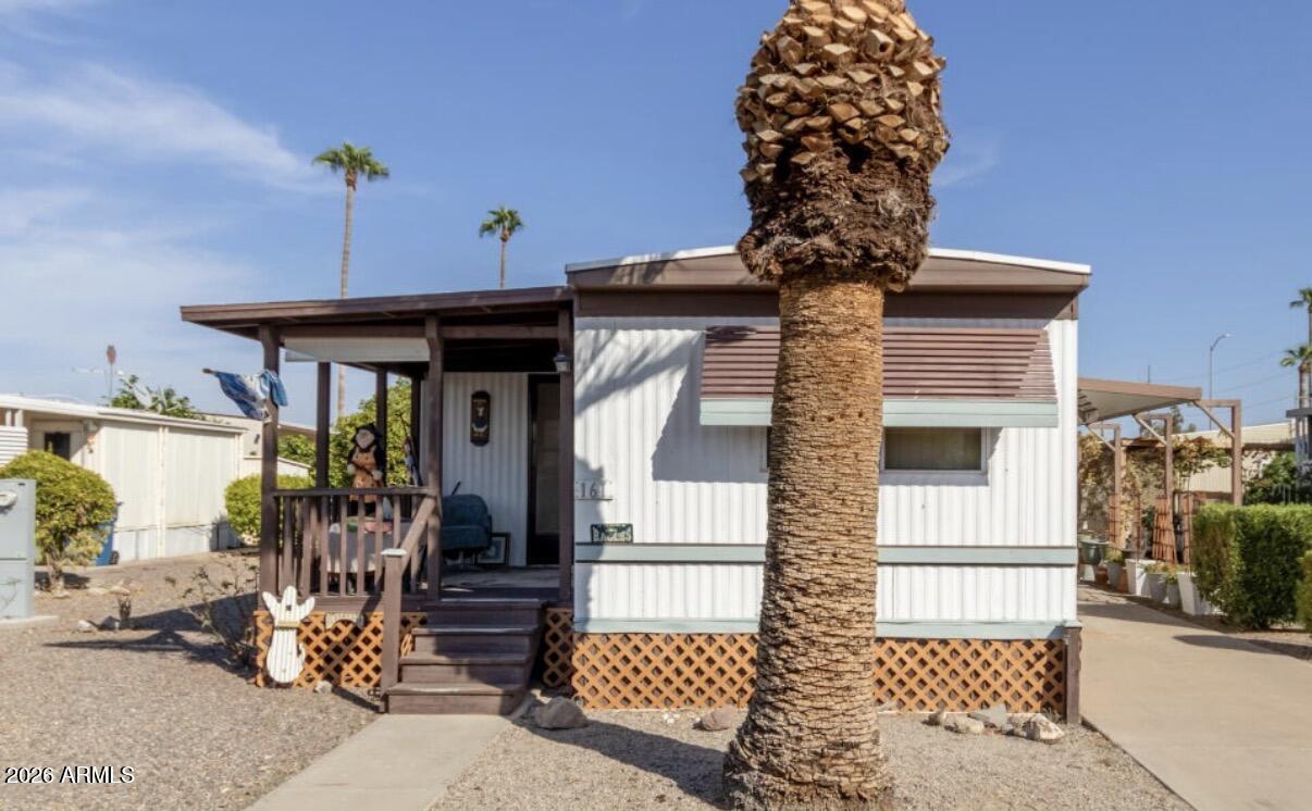 Welcome to this 2 bedrooms , 2 bath mobile home in the desirable Friendly Village of Orangewood . You are greeted by a welcoming front porch . Inside you will find a comfortable living room with a neutral palette , blinds and soft carpeting . The kitchen features white cabinetry , tile backsplash and essential built in appliances . New roof completed this year and washer and dryer included . Step outside to a covered patio ideal for al fresco dining , plus a convenient storage shed for your extra belongings . Located in a vibrant community , residents enjoy access to fantastic amenities including a golf course , pool , heated jaccuzzi , walking paths , exercise room and more . This value won't disappoint !