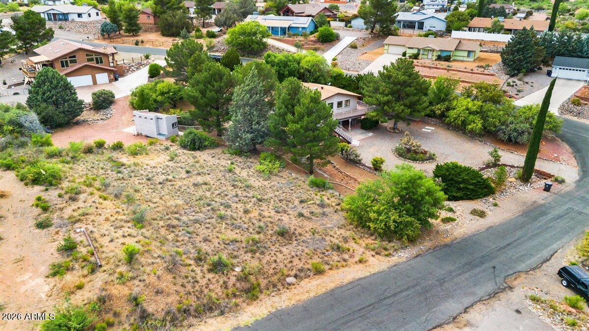 Build your dream home on this .32-acre lot in Verde Village featuring unobstructed Sedona Red Rock views. Enjoy added privacy with a tall wood fence bordering the south side of the property. City water hookup is available, making this an ideal opportunity to create your perfect retreat in the Verde Valley. Lot may also be purchased together with MLS #7025152.