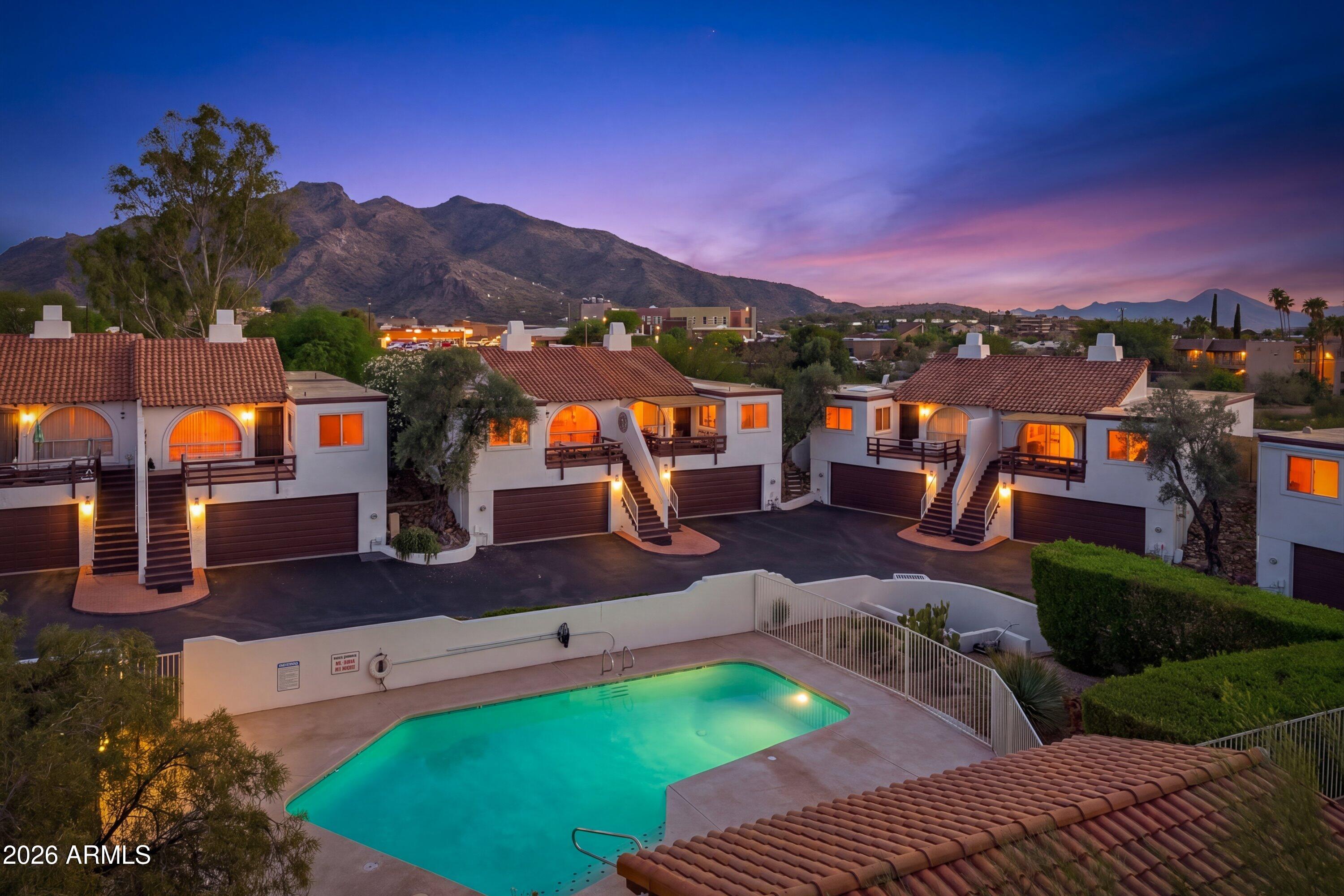 Happy Hollow is the Melrose Place of Carefree, Arizona. Tucked into an intimate enclave of only 13 residences, this completely remodeled unit captures the rare blend of lifestyle, charm, privacy, and community that owners here never want to leave. In fact, many sales happen quietly off market as current residents often choose to ''upgrade within'' the community rather than leave it. Surrounded by incredible mountain views, glowing Arizona sunsets, and the unique character that makes Carefree so beloved, this residence offers a lock-and-leave lifestyle without sacrificing warmth or personality. Thoughtfully updated throughout, the home blends modern finishes with the relaxed architectural vibe Happy Hollow is known for. This home features one of the few private yard spaces.