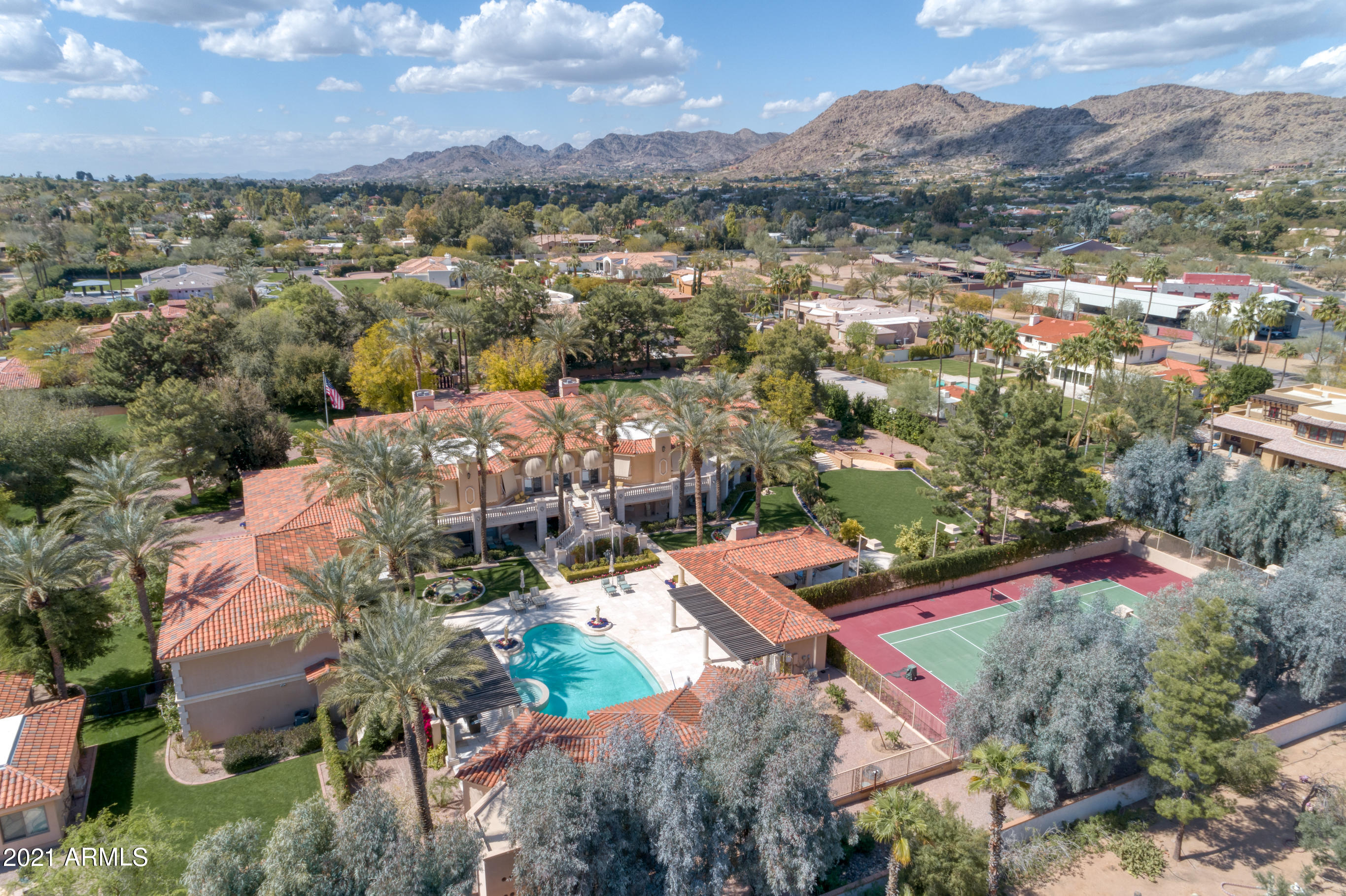 Extravagant Elegance Awaits you at this 3 1/4 Acre Private Estate in the coveted Casa Blanca area of PV. Complete with a 2bed/2bath Guest Home, FULL-SIZE INDOOR BASKETBALL Court, Tennis Court, Palatial Swimming Pool+Spa+Pool House, Home Theater, Wine Cellar + MORE. This 18,000+ sq ft residence has beautiful Mountain Views + features Immaculate landscaping with lush grass, numerous citrus trees, custom fountains + several charming sitting areas surrounding the property. This French-Inspired Chateau was Lavishly Renovated in 2012 with Custom-Carved Mahogany cabinets, Marble flooring, Hand-carved ceiling moldings + the most expensive fixtures + furnishings from all over the world. Gorgeous Chef's Kitchen + FULL Butler Kitchen + 3rd Full Kitchen off Large Guest Suite - all equipped with the most high-end appliances + finishes. Each of the luxurious 9 Guest En Suites is appointed with a sitting area/room, large walk-in closet + double doors leading to a private patio. 8-Car Garage - 6 attached to Main home with 2 attached to Guest Home. Guest Home is almost 2,000 sqft with Full Kitchen, Full Laundry Room, 2bed/2bath, and vegetable garden.