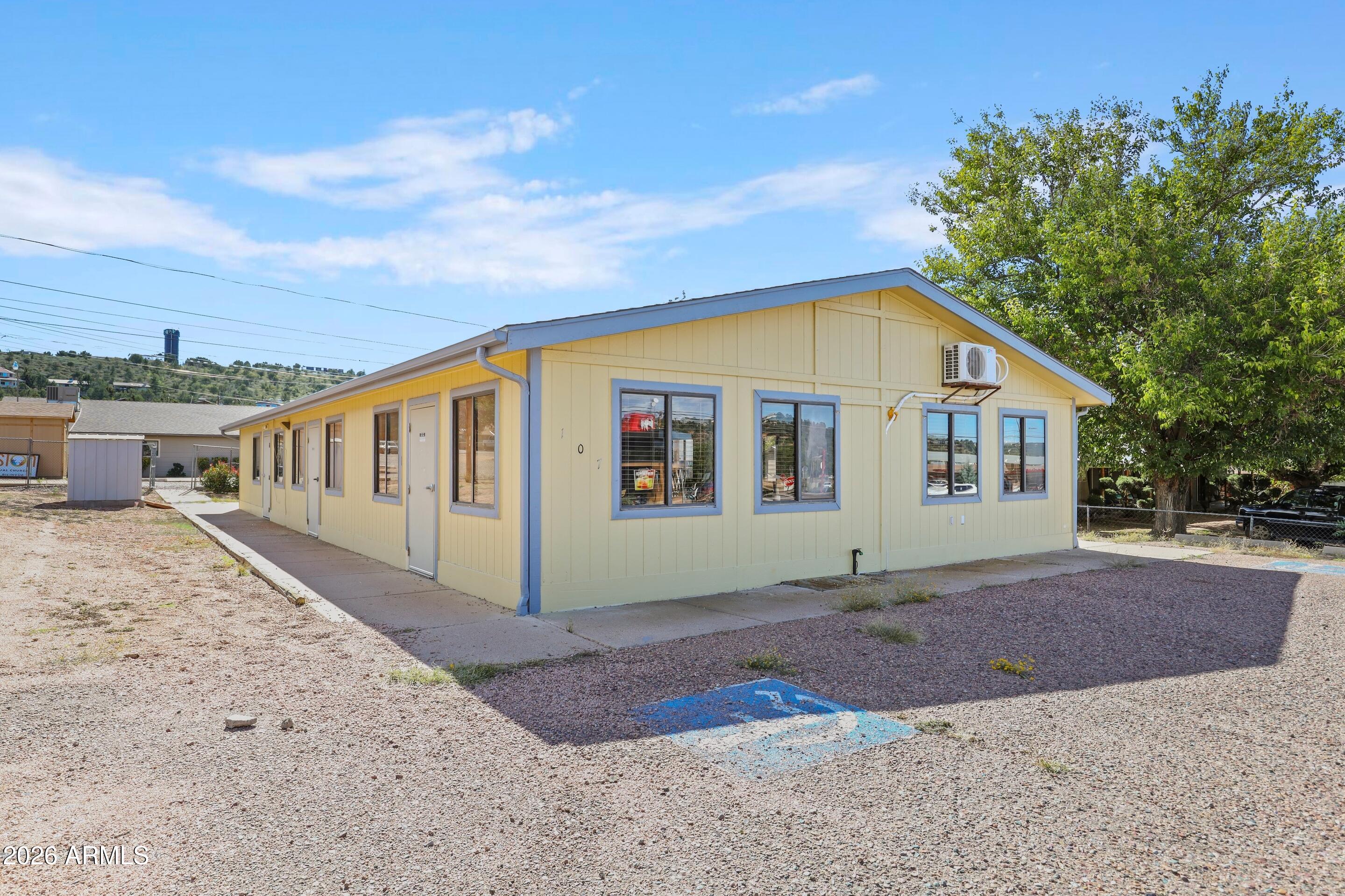 Modular building has large open area with 2 separate offices and 2 exterior entry keyed restrooms. Shed for storage. Parking in front for easy access to level lot.