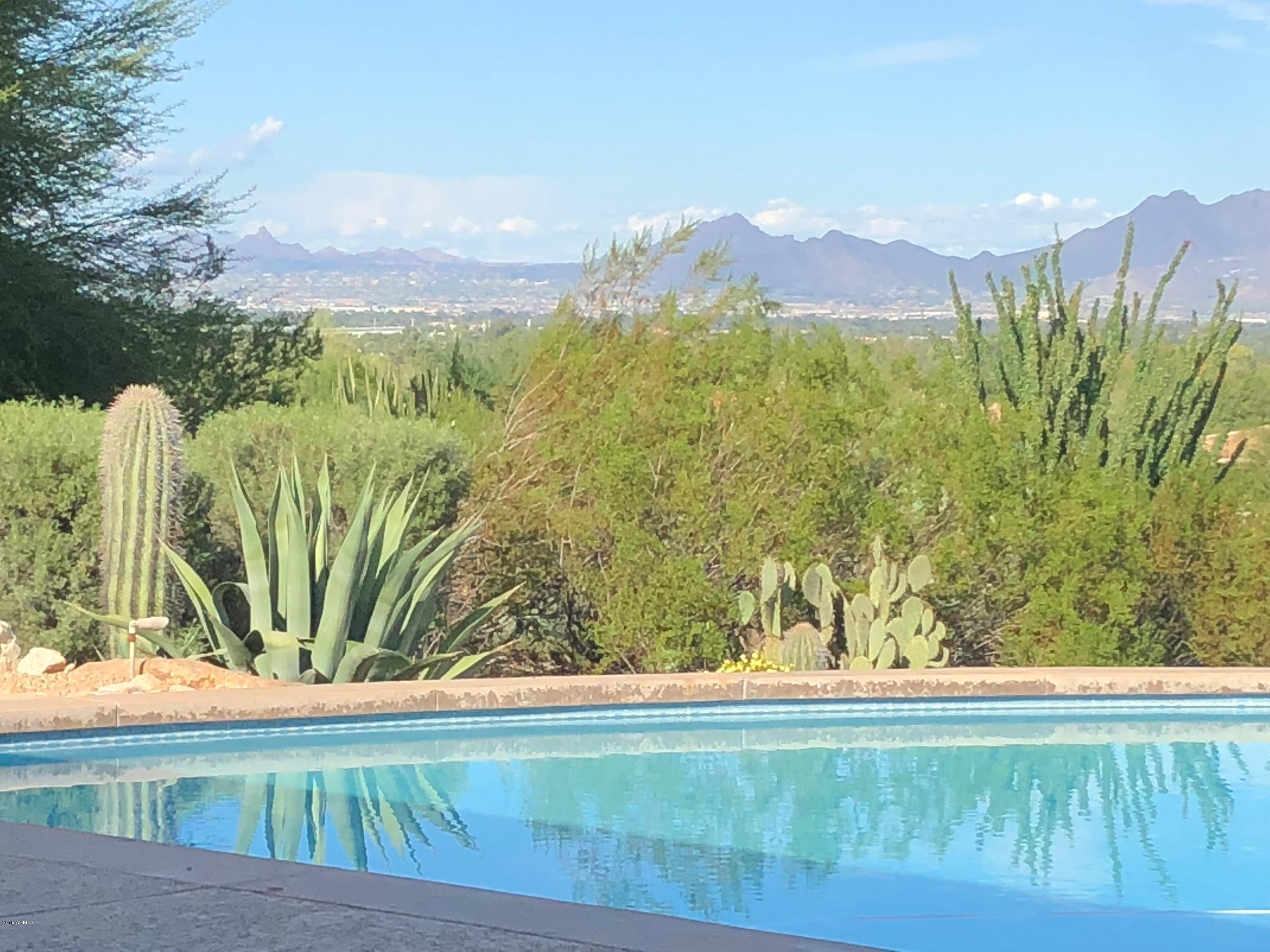 360 DEGREES OF VIEWS IN ONE OF THE BEST PV QUADRANTS!!  Prime elevated 2.52 acre flat lot with a gentle slope. NON HILLSIDE ORDINANCE.  Unobstructed views of Carefree, Pinnacle Peak, Four Peaks, Red Mountain, Mummy Mountain etc. 5,500+ SF contemporary home with floor to ceiling windows that take advantage of the spectacular site. Home has a finished basement with full kitchen & full bath.  Entertainers dream backyard  with various patios, bar/cabana, outdoor kitchen -  600 amp service available. Perfect remodel, or build your dream home on 2.5 acres of privacy.
