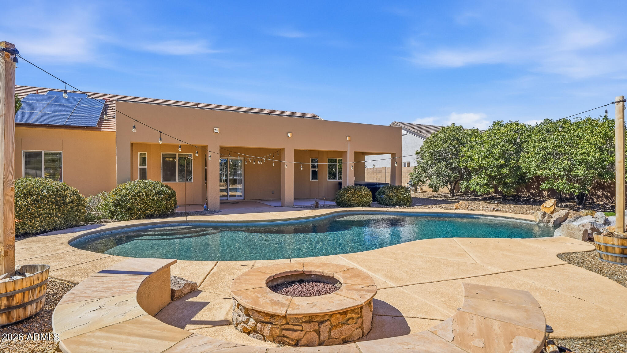 Live the Arizona dream in gated La Terraza! This stunning 4-bedroom, 2-bath home on nearly ½ acre features a sparkling pool with fountain, outdoor kitchen, firepit lounge, and breathtaking mountain views--perfect for unforgettable sunsets. Inside, enjoy granite countertops, gas range, double pantries, breakfast nook, formal dining, and two spacious living areas. The private primary suite offers a bay window, dual sinks, soaking tub, walk-in shower, and large closet. Bonus: owned solar for energy savings, smart thermostat, and water purification system. Your perfect blend of comfort, style, and outdoor living awaits!