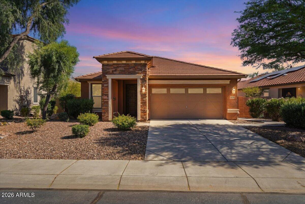 Welcome to this beautifully maintained former model home in the sought-after Bella Via community. Offering 3 bedrooms, 2 bathrooms, and a versatile den/office with a built-in wall unit, this home features a spacious open-concept layout ideal for everyday living and entertaining. The gourmet kitchen includes double ovens and overlooks the living and dining areas. Upgrades include designer two-tone paint, 8-foot interior doors, surround sound, a custom Classy Closet in the primary suite, garage cabinets with a built-in workbench, and low-maintenance landscaping. Recent updates include a new water heater and refrigerator (2024). Enjoy parks, playgrounds, and walking/biking trails, all near shopping, dining, top-rated schools, freeways, and Mesa Gateway Airport.