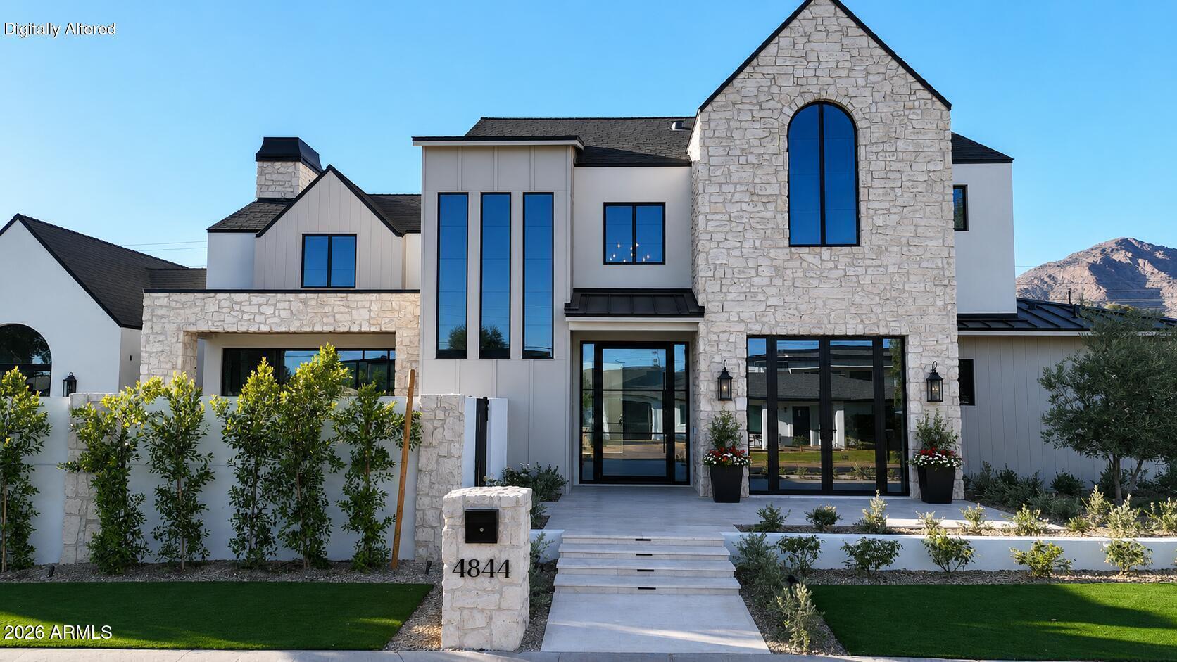 This Mediterranean Modern custom home located in the desirable Arcadia-Osborn neighborhood is one of a kind. Designed with intention, built with quality, and finished with Arcadia-level materials that truly stand apart. This thoughtfully designed open-concept floor plan seamlessly integrates the great room, kitchen, and dining areas. The primary suite on the main level offers both convenience and privacy creating a perfect balance of everyday comfort and elevated design.

The kitchen serves as a true focal point, showcasing Taj Mahal quartzite countertops with a striking half-waterfall edge, paired with cabinet paneled Monogram appliances, high-end fixtures and clean, timeless finishes. All bedrooms have an en-suite bathroom equipped with marble counters and flooring that brings a refined, spa-like feel.

The living room makes an immediate impression with white oak tongue and groove vaulted ceilings with beams centered around a gas fireplace with a limestone surround. Aluminum doors and windows flood the space with natural light and create seamless indoor-outdoor flow between the backyard and courtyard, which features a pool with a built-in automated cover and a built-in outdoor BBQ station.

Additional features include a 3-car tandem garage, 9-foot exterior doors, a 24-gauge standing seam metal roof, and a thoughtfully curated exterior with stone, synthetic stucco, vertical siding, and board-and-batten details. Lutron Maestro dimmers, security cameras, speakers, Kohler, Brizo, and Delta fixtures, and abundant storage further elevate the home's quality and functionality.

Located in a great neighborhood, this home is one you must see in person to fully appreciate. It absolutely speaks for itself.