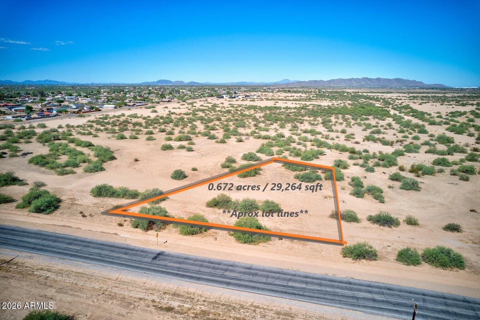 Don't miss this incredible opportunity to own a large 0.67-acre homesite in the fast-growing area of Eloy, zoned R1-12 with no HOA. This property sits on a paved road & is one of the larger lots in the community, w/ homes already built nearby. Utilities are conveniently nearby, w/ the city water main approximately 10-20 feet away & utility poles located directly across Estrella & at the corner. Ideally located w/ easy access to I-10 & I-8, this lot sits halfway between Phoenix & Tucson, making it perfect for building your dream home or holding as a smart investment. The area is seeing major growth w/ new developments such as Lucid Motors, Nikola Motors, & Atessa Raceway bringing increased demand & future value. Lot lines are approximate. Buyer & buyer's agent to verify all utility info.