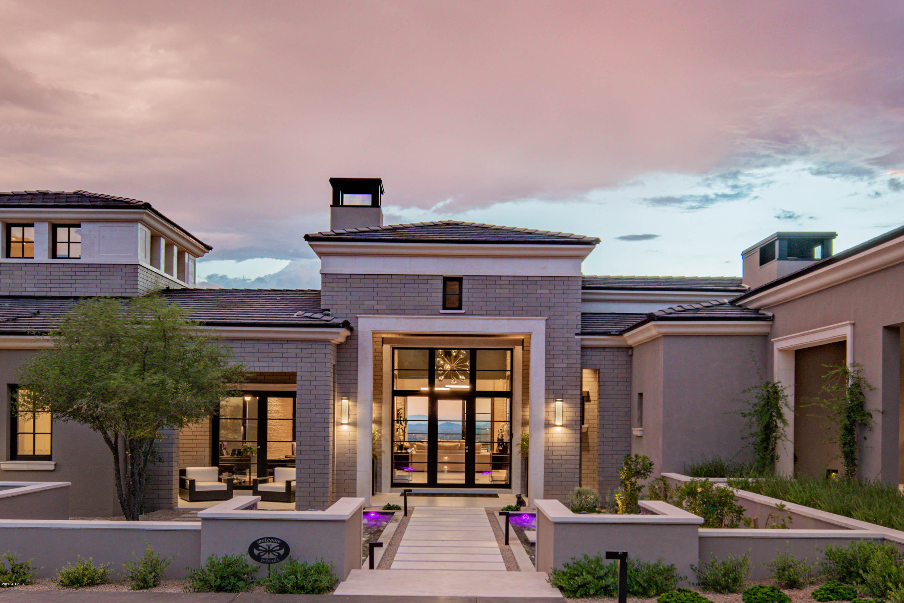 The living is easy in this sophisticated, modern masterpiece located in the Upper Canyon of Silverleaf. Spanning over 12,000 square feet on an elevated lot, this cosmopolitan residence features ever expanding views from all rooms. The sleek, cutting edge kitchen is clad with premium finishes and fixtures including custom Italian Armony cabinets. Walls of glass showcase the views while opening the home to the awe-inspiring upper terrace and outside living space, which can be seen from the kitchen, dining and living room. The lower level is an entertainers dream with a walk-in glass wine cellar, an expansive media/game space, separate home theater and an inside half basketball court. Large covered patios flow to the exquisite outdoor spaces and infinity edge pool. SHOWINGS FEB 6-13 ONLY.