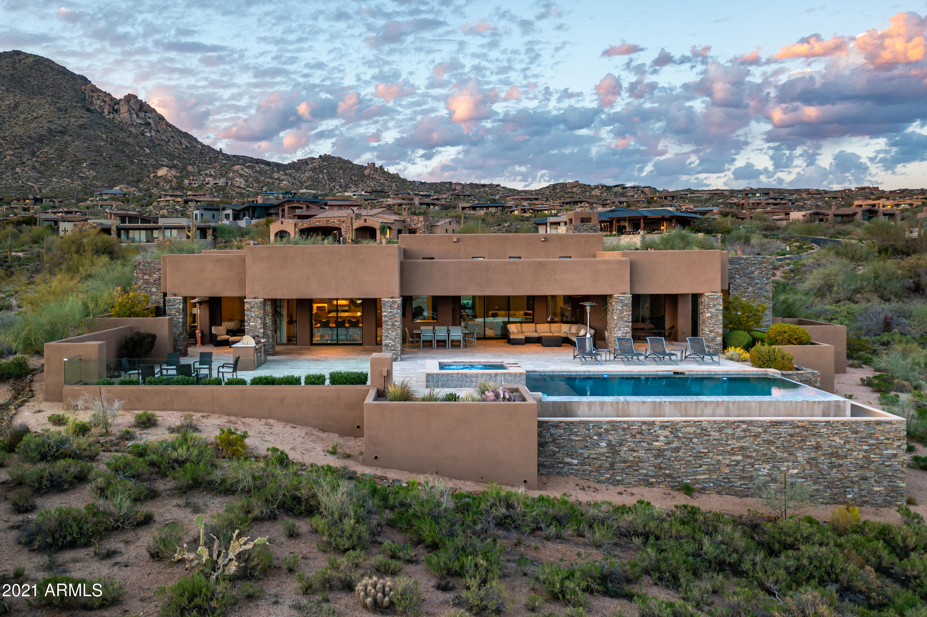Spectacular single level contemporary Mortensen Signature Luxury Home with AMAZING city lights, sunsets and mountain views.  Open great room floor plan with four suites (two of which are Master Suites), study (could be a 5th bedroom) plus terrific outdoor patio space to enjoy all of the views complete with pool/spa/fire feature and BBQ.   List price includes all furniture, rugs, electronics, most art and accessories, small exclusion list will be provided by seller.  Truly a must see!