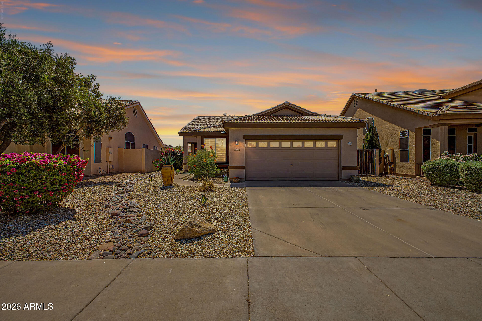 Beautiful Chandler home featuring a private pool and thoughtfully designed living spaces throughout. The spacious kitchen offers a center island, ample cabinetry, and a bright breakfast nook, seamlessly opening to the inviting family room complete with soaring vaulted ceilings and a cozy fireplace. The serene primary suite serves as a private retreat with a charming bay window, large walk-in closet, and spa-inspired ensuite featuring dual vanities, a soaking tub, and a separate shower. Step outside to a meticulously maintained backyard with a covered patio, putting green & sparkling pool with a Baja step, perfect for relaxing or entertaining year-round. Ideally located near premier shopping, dining, and everyday conveniences, this home combines comfort, style, and an exceptional location.