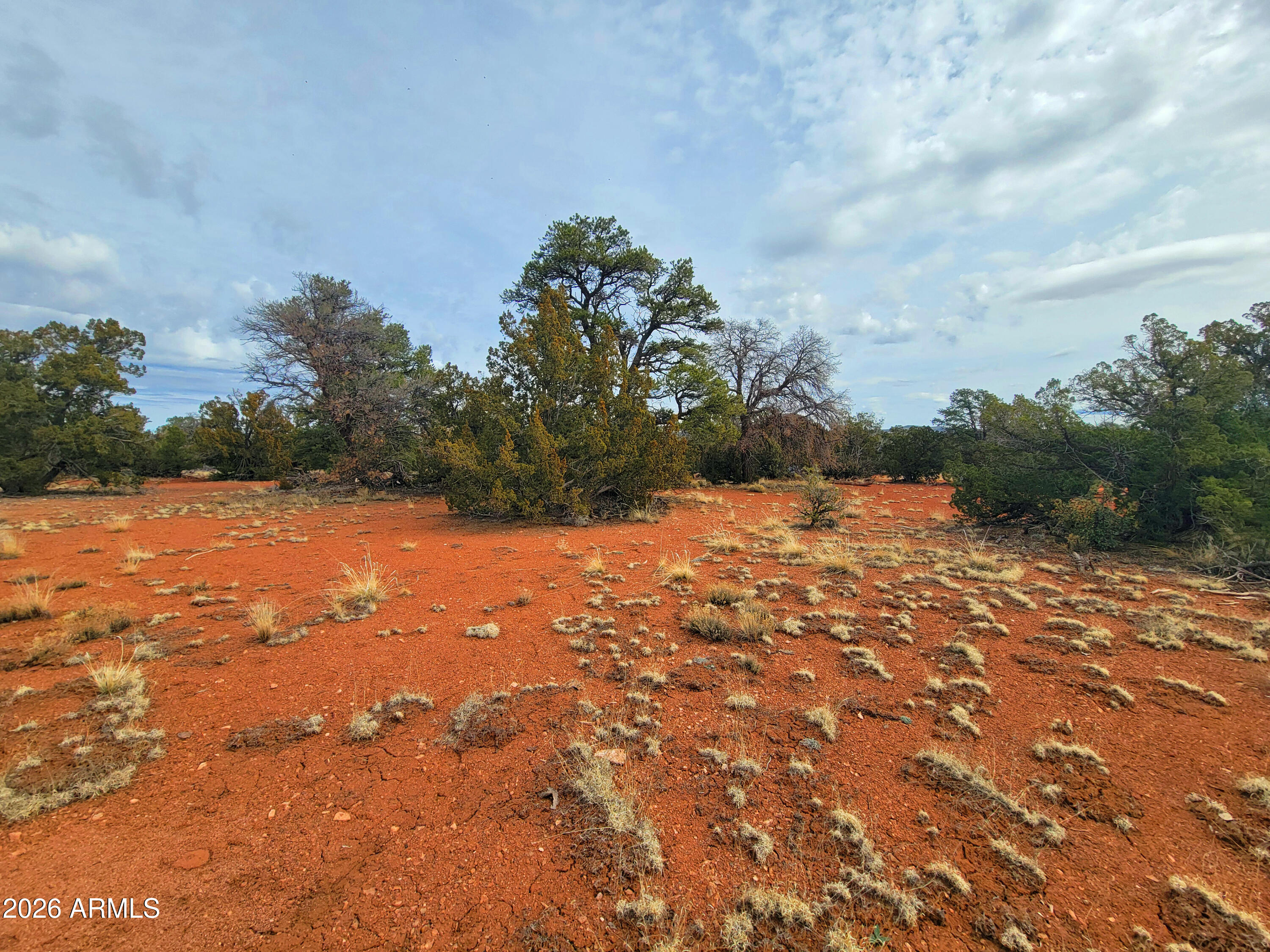 Experience the beauty of Northern Arizona with this spacious 1.07-acre parcel in Williams. Surrounded by wide-open skies and peaceful high-country scenery, this property offers the ideal setting for a custom cabin, seasonal retreat, or future homesite.
Enjoy the privacy and serenity of rural living while being just a short drive from historic downtown Williams, iconic Route 66, and the Grand Canyon. Whether you're looking to build now, create an off-grid getaway, or hold as a long-term investment, this property provides endless possibilities.
With room to spread out, breathtaking sunsets, and incredible stargazing, this parcel is your opportunity to own a piece of Arizona's scenic high country. Bring your vision and make this beautiful property your own.