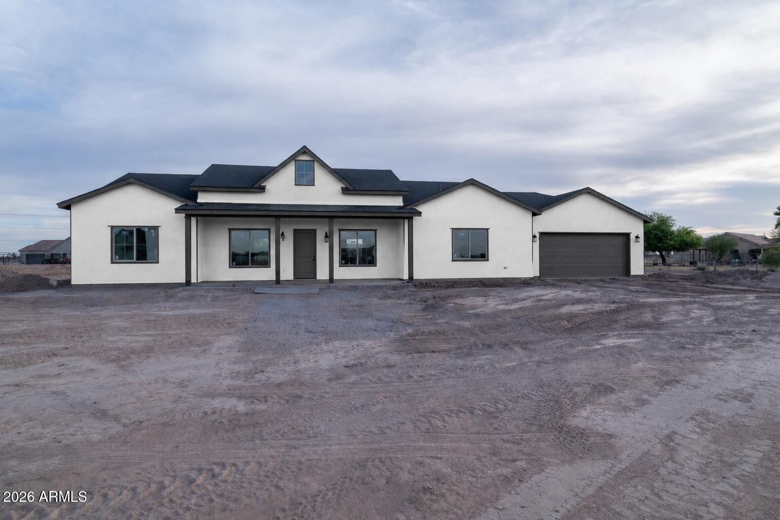 Welcome to 460 S Jericho Rd in Casa Grande--an exciting new construction opportunity projected for completion in mid-July! Nestled in a quiet, family-friendly neighborhood surrounded by open farmland, this beautiful 4-bedroom, 2.5-bath home offers the perfect blend of country living and modern convenience.

Step inside to an open split floor plan featuring gorgeous wood-look tile flooring throughout, creating a seamless and stylish living space. The spacious dine-in kitchen is designed for gathering, with plenty of room for entertaining, meal prep, and everyday living. The private owner's suite is thoughtfully separated from the secondary bedrooms, providing comfort and privacy.

Additional features include a large laundry room complete with a convenient drop area, a deep garage with e storage potential, and horse-friendly acreage that gives you room to enjoy the rural lifestyle you've been dreaming about.

Enjoy the peace and quiet of country living while remaining just minutes from everything Casa Grande has to offer. Located only 8 minutes from I-10, Target, Harkins Theatres, dining, and shopping, and just 12 minutes from Banner Casa Grande Medical Center, you'll appreciate having everyday conveniences close at hand.

Don't miss your chance to own a brand-new home with space to spread out, horses welcome, and easy access to town. Photos may include virtual renderings. Final finishes and features are subject to change.
