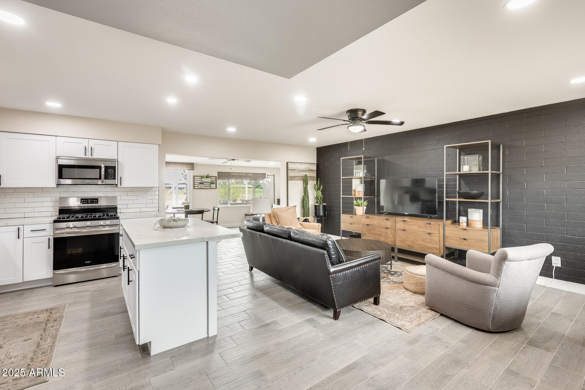 This beautifully remodeled 3-bed, 2-bath home is nestled in a vibrant golf course adult community, offering timeless charm with modern updates. With 1,440 sqft of well-designed space, it features a cozy family room and an enclosed Arizona room, perfect for year-round enjoyment. The open-concept design is enhanced by a stylish two-tone neutral paint scheme, woven window shades, contemporary ceiling fans, and plank wood-look tile floors. A brand-new roof and windows were installed in 2022, providing peace of mind for years to come. Step outside to enjoy breathtaking Arizona sunsets and expansive views from two inviting pergolas in the backyard. The community offers fantastic amenities, including a clubhouse, pool and spa, tennis court, and more, ensuring a fulfilling and active lifestyle!