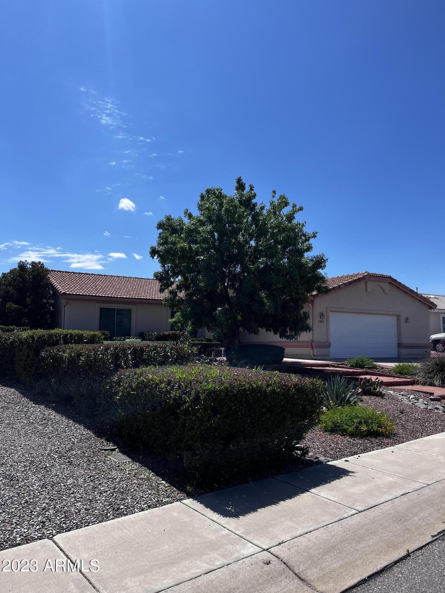 A home in the Prestigious Canyon De Flores. Large entertaining size back yard. Sizable Master suite. Master bath has double sinks and separate shower/tub. Home is clean and ready for your family to move in! Fantastic location... to the movies, restaurants, Fort Huachuca or head out to the Canyons!  Very close in proximity to most anything you need. Stainless steal appliances adorn the kitchen...And MEN, check this out, an over sized extended garage! Space for workshop or work out,  Yours to do with what you want, if the wife lets you of course...Come on in.....