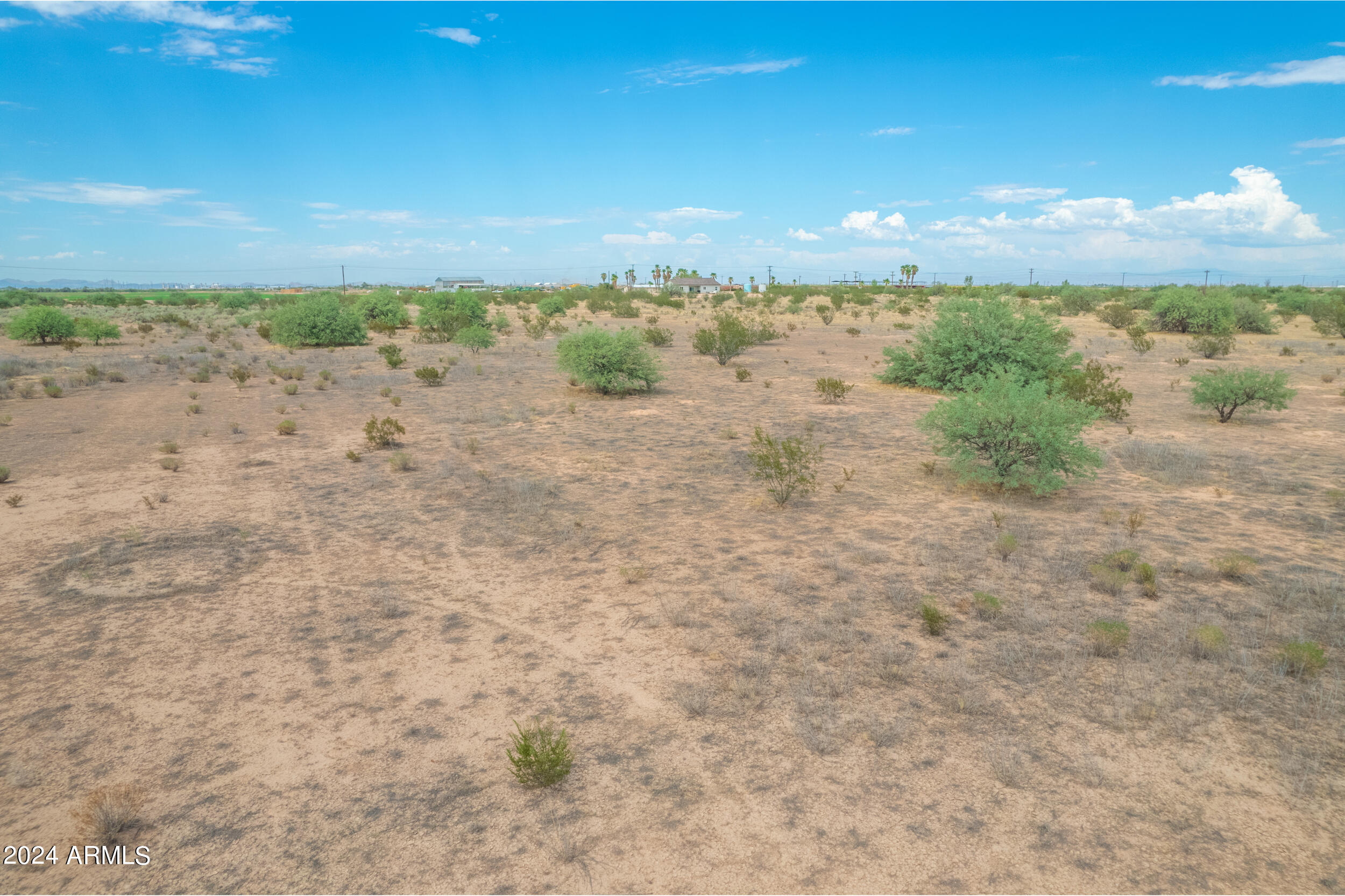 Escape to the tranquility of rural living with this stunning 1.25-acre piece of raw land in Casa Grande, Arizona. Tucked away in a quiet, country setting, this property offers the perfect canvas to create your dream home. With NO HOA restrictions, you have the freedom and creativity to design the lifestyle you've always wanted.

This parcel is deed-restricted to site-built homes, ensuring a neighborhood of quality residences with a minimum requirement of 1,500 square feet. 

Practical utilities are within reach, with water available under 350 feet to the East and electricity accessible within 660 feet to the North. Whether you're looking to build your forever home or a peaceful retreat, this property offers the best of rural living. Make it yours today!