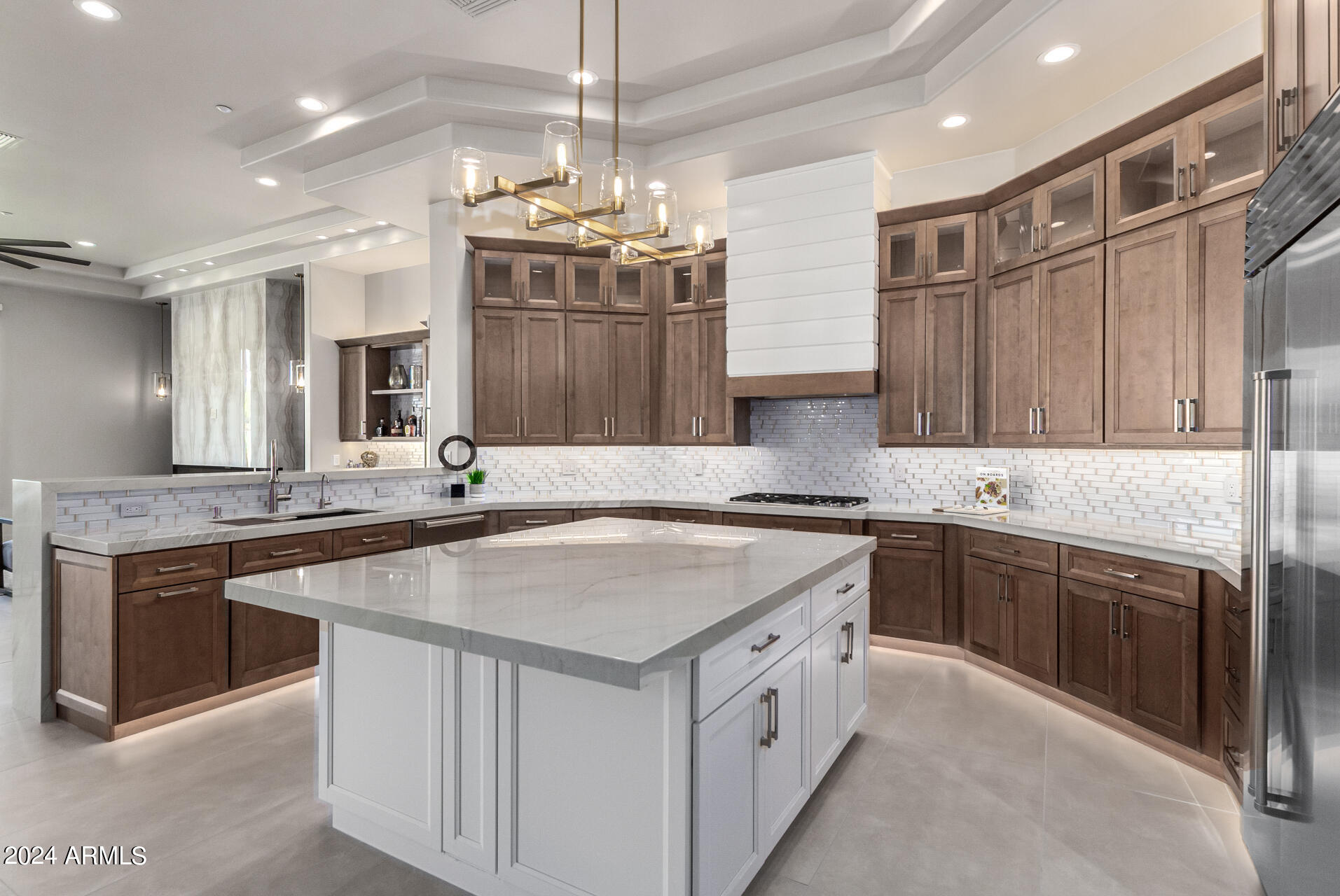 Beautiful Remodel just completed! This is the home you've been waiting for.  Gorgeous high quality remodeled inside & out, Single Level, Amazing Golf Course & Mountain Views! Located on the 10th Fairway in the hugely popular guard gated Ancala Country Club (various types of optional memberships available). Just a block from the clubhouse allowing for a short walk or golf cart ride! Remodeled with high end finishes & attention to detail that will exceed your expectations. 5 Bedrooms, 4 ½ Baths, 3 Car Garage & a View Deck to enhance the already amazing views. The front entrance will welcome you with a new impressive iron door & large format tile entryway. The refreshed landscaping, new lighting & exterior paint provide great curb appeal. This single level home has no steps or carpet, new 8' doors & high ceilings throughout, 2 redesigned fireplaces, new lighting, fans, cabinets, countertops, hardware, base boards, casings, interior paint, additional can lighting & so much more.

Upon entering the front door, the spacious Living Room is straight ahead with a new Multi-Slider Door that overlooks gorgeous golf & backyard views. The living room has a new doorway leading to the kitchen/family room area to improve the indoor/outdoor open concept. 

The Kitchen/Dinette is open to the family room & bar area providing a remarkable open entertaining space. It offers a large island with seating & storage, spacious dinette area, new soft closing cabinets with crown molding, under cabinet lighting, toe kick lighting & up-lighting. The kitchen features Wolf & SubZero Stainless Appliances.  A gorgeous glass backsplash, waterfall peninsula & custom hood vent give a high-end look along with the beautiful Mont Blanc natural stone Quartzite countertops. Large windows provide lots of natural light and views of the beautiful backyard.

The Family Room is open to the kitchen and offers a wet bar, built-in speakers and a gorgeous new linear fireplace with pendant lighting. The Bar has a new wine/beverage center and provides a great place to entertain and store your barware.

Close to the kitchen is a spacious formal Dining Room with a stunning coffered ceiling. 

The Primary Bedroom Suite welcomes you with lots of natural light, a coffered ceiling, beautiful Quartzite Wall Feature with pendant lighting, a redesigned gas fireplace, built-in speakers and an exterior exit to the inviting backyard. 

The Primary Bathroom is sure to be a WOW factor! The luxurious walk-in shower features a new designer style surround with a lighted niche & bench, new rain shower head, 2 shower heads and custom-built shower glass. Additionally, the Primary Bathroom includes a large freestanding tub, his & her's soft closing vanities with Quartzsite countertops, all new faucets, sinks, mirrors, hardware and a separate water closet. The all new professionally designed walk-in closet offers plenty of features and storage.

4 Guest Bedrooms each have large closets, new floors, new base boards, new closet doors and new lighted ceiling fans. One of the bedrooms has an ensuite bathroom and walk-in closet. 

The 3 Guest Bathrooms and Powder Room all feature new soft-closing vanities, Quartzite countertops, Kohler toilets, sinks, faucets, mirrors, shower doors, shower surrounds, bath accessories and floors, 

The Laundry Room includes a new washer and dryer, new soft-closing cabinets, Quartzite countertops, laundry sink and faucet.

The beautiful Backyard remodel includes new limestone pavers, maintenance free turf, landscape lighting & refreshed landscaping. You will enjoy the large covered patio with a built-in heater, built-in speakers, remote controlled sun shades & new lighted ceiling fan. The beautiful sparkling pebble tec heated pool and spa feature a spill over, waterfall and Pentair automation. A new sitting area with a built-in natural gas firepit was created overlooking the amazing views of the 10th fairway. A new BBQ area was also created with counter seating. The view deck is a perfect place to have a glass of wine, watch the sun set and enjoy the beautiful McDowell Mountains. 

The 3 Car Garage was freshly painted and features built-in cabinets, epoxy floor and new baseboards. The Garage is fully insulated and Air Conditioned!

Additional features include 10'-12' ceilings throughout, all new roof underlayment just installed in 2024 that comes with a transferable warranty, soft water system, reverse osmosis and central vac.

Located near amazing Scottsdale City Schools with IB Programs and nationally ranked Basis Charter Schools. Also close to hiking, shops, restaurants, golf, parks & more. Ancala is an amazing community with lots of planned activities and interest groups. The wine tastings and progressive dinners are huge hits and a great way to get to know your neighbors.