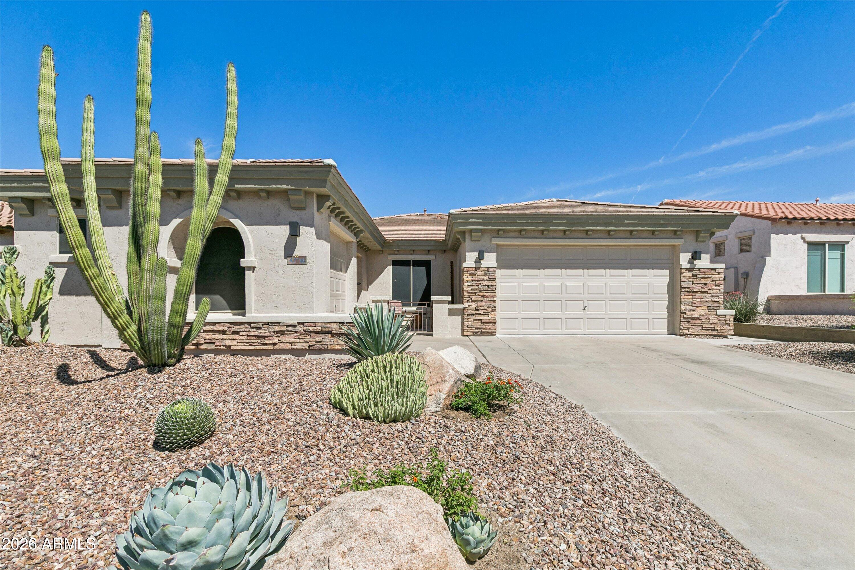 Welcome to Anthem living at its finest! This beautifully updated 5 bedroom, 3 bathroom home offers an entertaining floorplan with both formal living and family rooms, creating the perfect balance of comfort and functionality. Situated on a premium lot, the low maintenance backyard provides space to relax and enjoy Arizona living without the upkeep. The spacious kitchen opens seamlessly to the main living areas, while the updated primary bathroom and numerous upgrades throughout add modern style and convenience. A front courtyard creates charming curb appeal, and the 3 car garage offers plenty of storage and parking. Major updates include a new roof and exterior paint completed in 2026. Enjoy living in one of the area's most sought-after master-planned communities featuring resort-style pools, fitness center, water park, fishing lake, sports courts, walking trails, playgrounds, community events, and the expansive 63-acre Community Park.