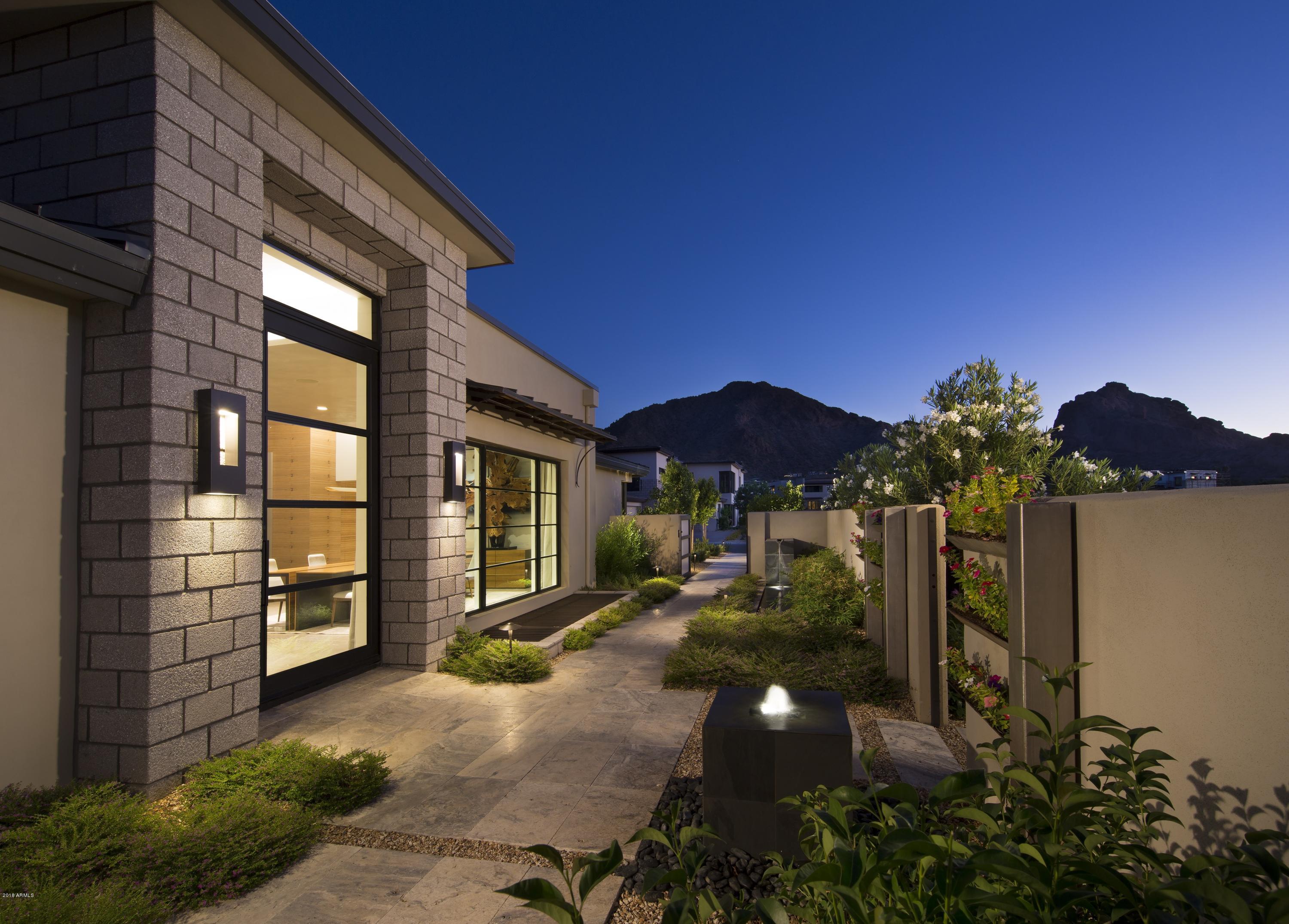 BRAND NEW CONSTRUCTION! NESTLED AT THE BASE OF THE VALLEY'S MOST ICONIC NATURAL LANDMARK, CAMELBACK MOUNTAIN, THE VILLAGE AT MOUNTAIN SHADOWS IS SITUATED IN THE HEART OF PARADISE VALLEY. THIS EXCLUSIVE GUARD GATED ''LOCK AND LEAVE'' RESORT STYLE COMMUNITY IS NEARING SELLOUT! TO BE BUILT BY CULLUM HOMES IS THIS CHOLLA CUSTOM FLOOR PLAN, WITH 3 BEDROOMS PLUS A DEN/OFFICE, 3.5 BATHROOMS AND 3-CAR GARAGE. 3667 SF OF SPACIOUS LIVING SPACE.  GREAT ROOM WITH BUILT-IN FIREPLACE AND POCKET DOORS LEADING OUT TO THE COVERED PATIO. FORMAL DINING AREA. SPACIOUS KITCHEN WITH WALK-IN PANTRY, EAT-AT BAR AND KITCHEN ISLAND.  ALL STAINLESS-STEEL APPLIANCES INCLUDING SUB-ZERO SIDE-BY-SIDE FRIDGE/FREEZER AND WOLF 8-BURNER GAS RANGE. FULL SIZE WET-BAR AREA WITH EAT-UP BAR SEATING, WINE ROOM, AND BUFFET WINDOW THAT OPENS TO THE PATIO AREA. OWNER'S SUITE WITH WALK-IN CLOSET, DUAL SINK VANITIES, SEPARATE SHOWER AND TUB. BOTH GUEST BEDROOMS HAVE EN-SUITE BATHS. PRIVATE DEN/OFFICE JUST OFF THE ENTRANCE OF THE HOME. LAUNDRY ROOM AND AN ADDITIONAL POWDER BATH. COMMUNITY POOL AND SPA AND LARGE COMMUNITY PARK. IN ADDITION, ALL RESIDENTS RECEIVE ACCESS TO THE PLETHORA OF AMENITIES AVAILABLE AT THE MOUNTAIN SHADOWS RESORT. GUARD GATED 24/7 FOR PRIVACY AND SECURITY SO YOU CAN ENJOY THAT "LOCK-N-GO" LIFESTYLE! POOL AND LANDSCAPING ALLOWANCE INCLUDED.