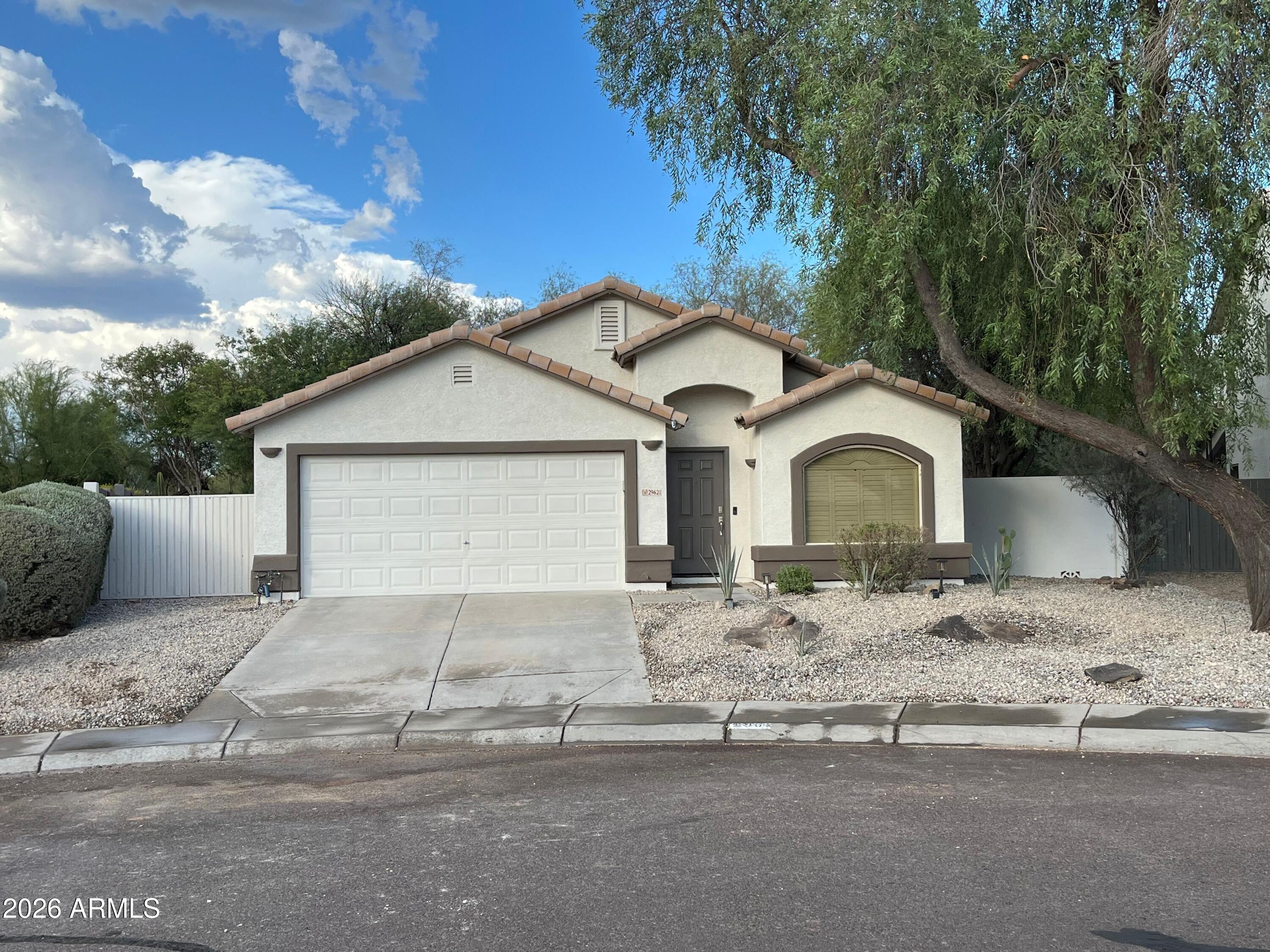 This inviting Cave Creek single-story offers a bright, open layout with stainless steel appliances, granite counters, a kitchen pantry, and a cozy den/office. Bedrooms are spacious with neutral finishes throughout. Step outside to your own private retreat featuring a sparkling pool, synthetic turf, and a putting green--perfect for relaxing or entertaining. The backyard is beautifully landscaped and private. Home also includes a 2-car garage, RV gate, and fresh, neutral interior touches. A fantastic home with great indoor and outdoor living.