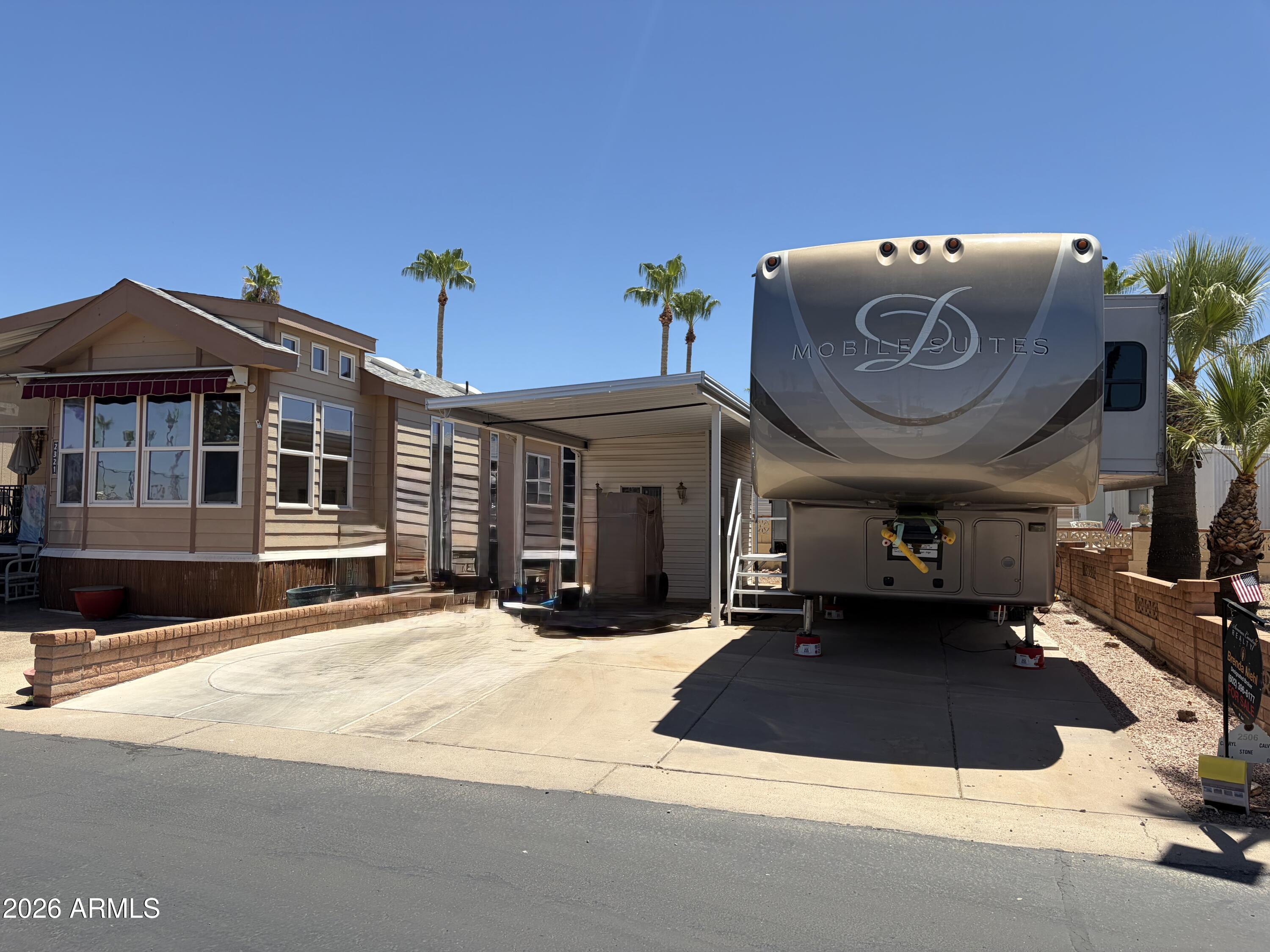 Nicely update RV lot in a 55+ golf course community. All utilities included, shed with washer/dryer and room to park the largest motor coach or RV! Available for sale is a 2015 DRV Mobile Suite Memphis 44 Model. 44 ft top of the line 5th wheel with 4 slide outs, king size bedroom, cedar lined closet, new walk-in shower, washer/dryer and 100 Gallon water capacity, 2 large awnings, center island kitchen, dish washer, 3 Ac's, vinyl plank flooring and a long list of other luxury upgrades! Priced separately at $59,900
