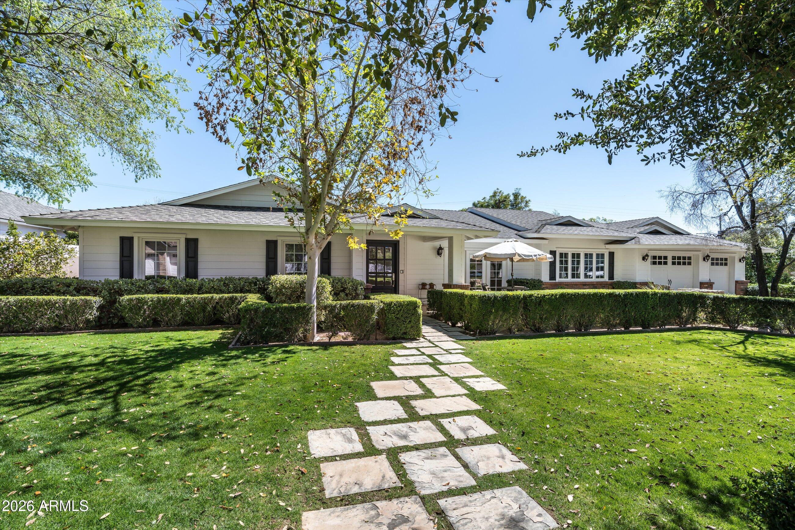 Located in the heart of Arcadia Proper, this beautiful 3,586 sq ft residence blends timeless design with modern comfort. The thoughtfully designed split floor plan features 4 bedrooms plus a dedicated office or flex room (optional 5th bedroom) and 3.5 baths, all complemented by soaring 10-foot ceilings and rich wood flooring throughout.

The open great room floor plan is ideal for both everyday living and entertaining, filled with abundant natural light. The chef's kitchen is appointed with Wolf and Sub-Zero appliances, a walk-in pantry, and seamless flow into the main living areas. A spacious mudroom adds everyday functionality and organization.

The professionally designed backyard by Berghoff Landscaping offers a private retreat with lush landscaping, a classic lap pool spa, and built-in BBQ - perfect for embracing Arizona's indoor-outdoor lifestyle. Inviting front and back patios provide additional outdoor living spaces.

Situated in one of Arcadia's most sought-after neighborhoods, this home offers the character, quality, and lifestyle that define Arcadia living.