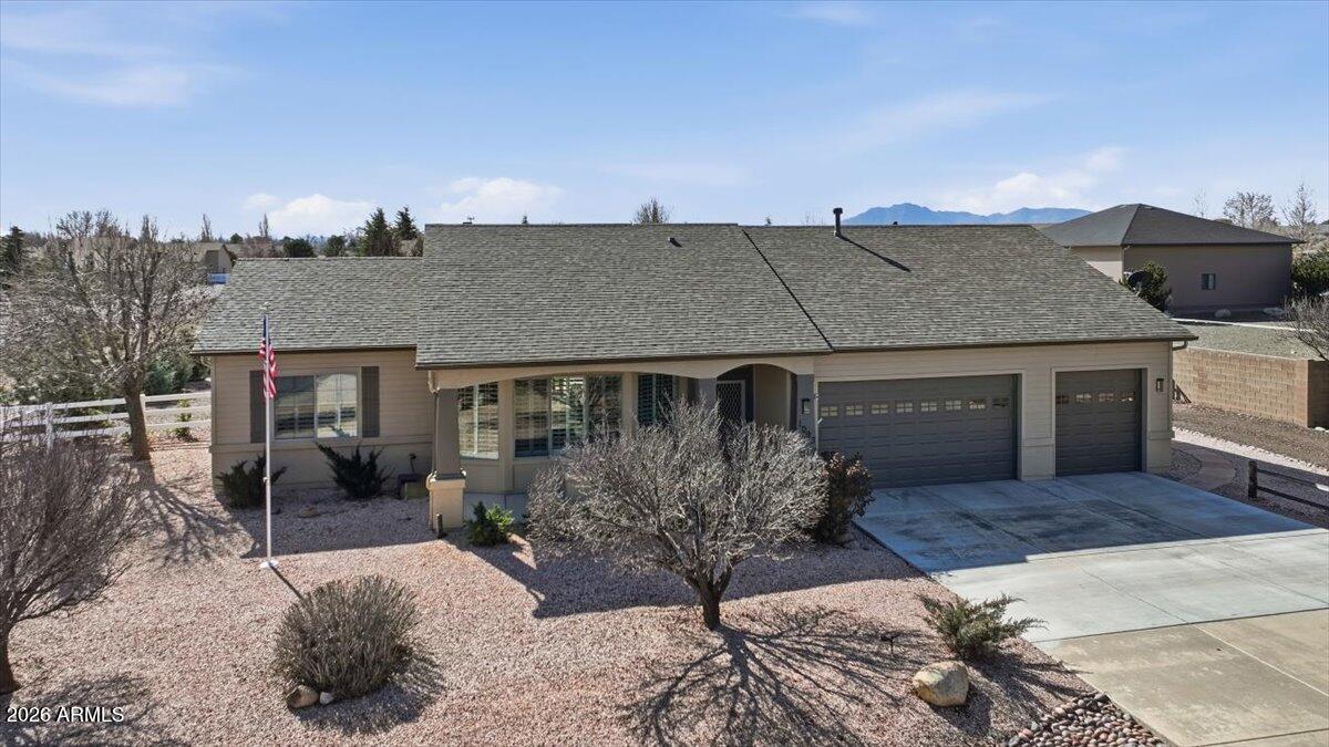 This beautifully remodeled property offers a complete package of upgrades, both inside and out. Brand-new roof! The open floor plan features a modern tiled gas fireplace, plantation shutters, remote-controlled power blinds, and ceiling fans throughout. The home showcases upgraded vinyl plank flooring (no carpet), Corian countertops, and newly upgraded cabinetry with soft-close drawers, all designed within a highly functional layout. The spacious primary suite includes a walk-in tiled shower, while both bathrooms feature elegant quartzite countertops. Additional interior highlights include a newly installed water softener and purification system, along with a generously sized laundry room. The exterior is equally impressive with fresh interior and exterior paint, seller-paid solar panels, a gas stub for BBQ, artificial turf, and fully landscaped front and back yards on a drip system. Enjoy added features such as new screens, a glass slider, a Ring doorbell, and a brand-new hot tub. Car enthusiasts and hobbyists will appreciate the three-car garage with epoxy flooring and built-in cabinets, as well as a detached two-car garage/shop complete with epoxy floors, utility sink, 220 wiring, car lift, garage opener, and air compressor. An attached carport and two additional powered sheds provide even more versatility. This property truly combines comfort, style, and functionality. The seller replaced the roof January 2026 on both the residence and detached garage. The new roof includes a 10-year warranty and a 15-year wind warranty, both transferable to the buyer at closing. Please refer to the documents tab for a full list of additional features.