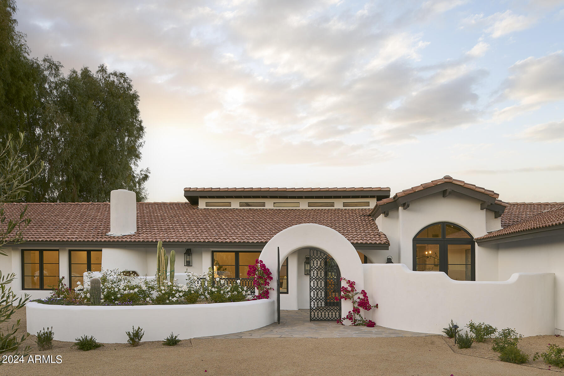 Rarely does a remodel infuse so much character into a property, giving a curated appeal to the design. Upon entry, the home's warmth is evident. Discriminating eyes will appreciate graceful arches, Kiva-style fireplaces, authentic textures and tones found in the wood, Saltillo tile and natural stone - an homage to Spanish-style architecture. Taken down to the studs and reimagined with comfortable luxury in mind, enhancements include Subzero/Wolf appliances, gorgeous oak flooring and new windows. Efficiency and functionality were also improved by adding a 4th garage bay and upgrading the home's subsystems, including bringing natural gas to the property. Generous patio spaces, a new pool/spa and Mediterranean-style landscaping are yours to enjoy, on one of the most beautiful streets around.