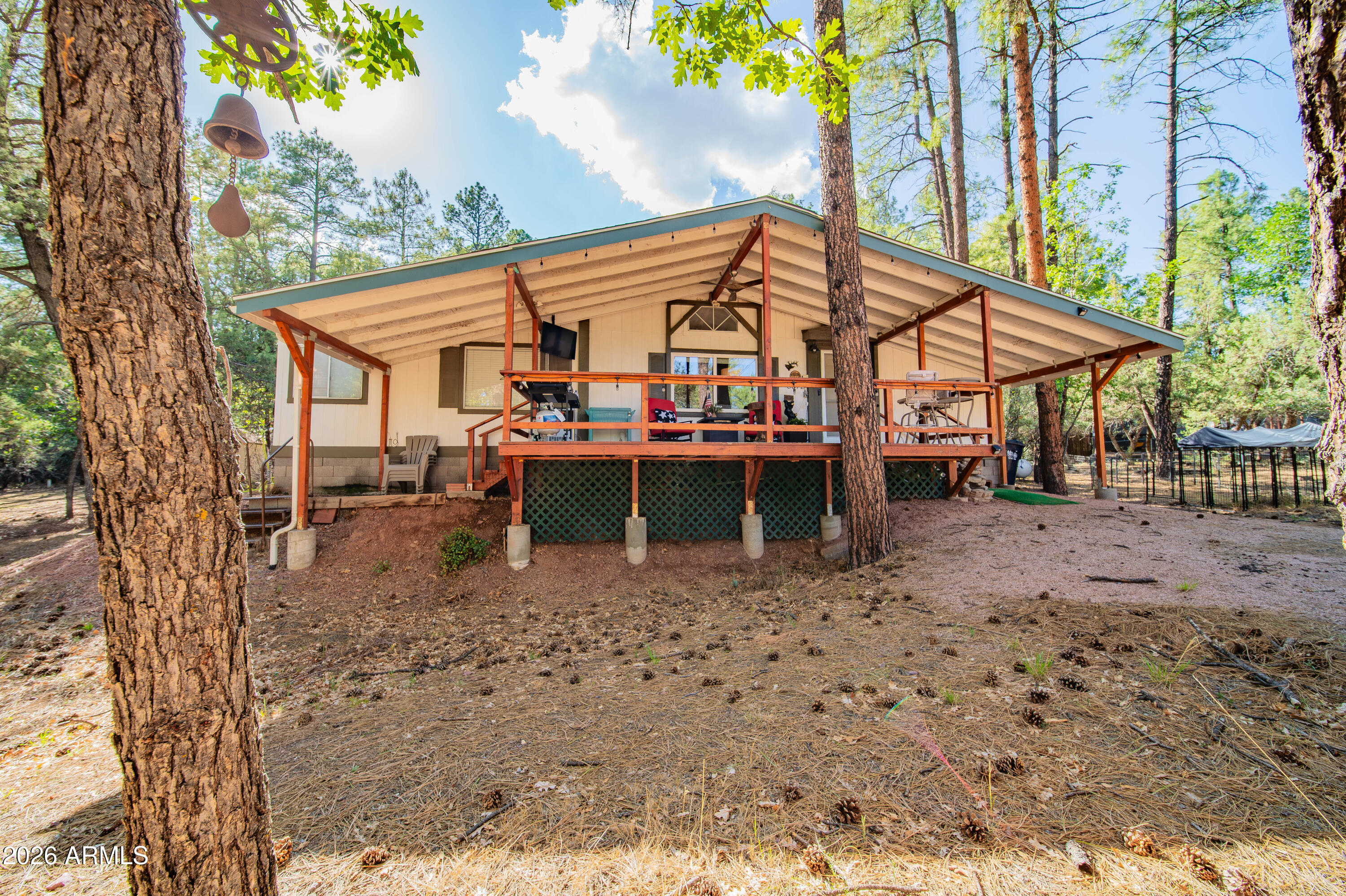 Here's your chance to own the perfect home nestled in woods of beautiful Pine, AZ! Situated at the end of a culdesac, you can enjoy peaceful & private times surrounded by beautiful pines, roaming elk & everything nature has to offer. Gorgeous front patio immediately greets you & covers the entirety of the front of the home. Spend your days bbq'ing, lounging & enjoying nature before even stepping foot into the home. The interior boasts an open layout, amazing upgrades & soaring vaulted ceilings. 3 beautiful bedrooms and 2 full bathrooms completes this perfect home. The home is situated perfectly on almost a half an acre & a beautiful brooke runs through when it rains. 2 spacious sheds for storage completes this pefect home!