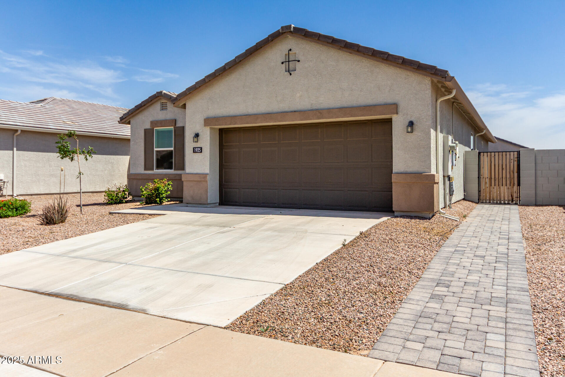 Minimize your electricity expenses with the provided SOLAR panel. This 3 bedroom/2 bathroom split floor plan presents an outstanding value proposition. The seamless open-concept living area and generous kitchen with island make it an ideal space for family bonding. The property also comes with a front yard desert landscape package, 2'' blinds, garage door opener, smart home package, and rain gutters. Explore the serene neighborhood of Heartland Ranch
