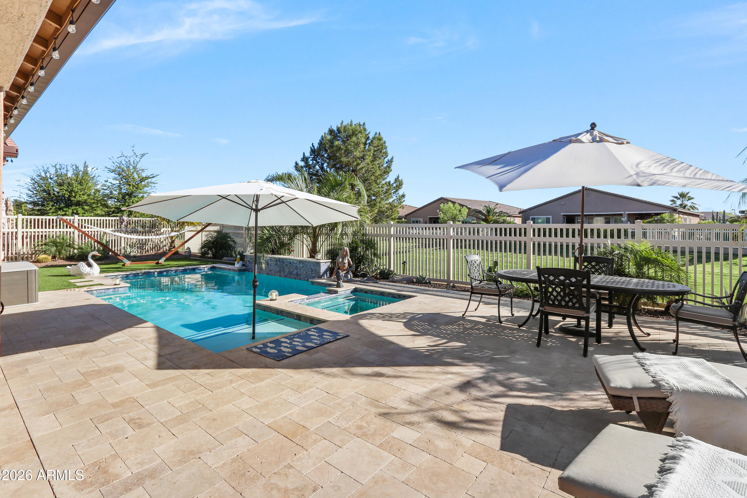 Exquisitely upgraded single-story home in the prestigious 55+ gated community of Province, featuring 3 beds + den, 3 baths, and a rare 3-car garage. Popular Simone floor plan with open-concept design, tray ceilings, tile plank flooring, and plantation shutters throughout. Gourmet kitchen with granite countertops, stacked cabinetry, gas cooktop, oversized island, butler's kitchen, and walk-in pantry. Spacious primary suite with spa-like bath, dual sinks, soaking tub, and walk-in shower. Enjoy a private south-facing resort-style backyard with extended covered patio, travertine tile, heated POOL, and SPA. 
Additional highlights include surround sound, recessed lighting, water softener system, and numerous quality upgrades throughout.
 Luxury living at its finest.