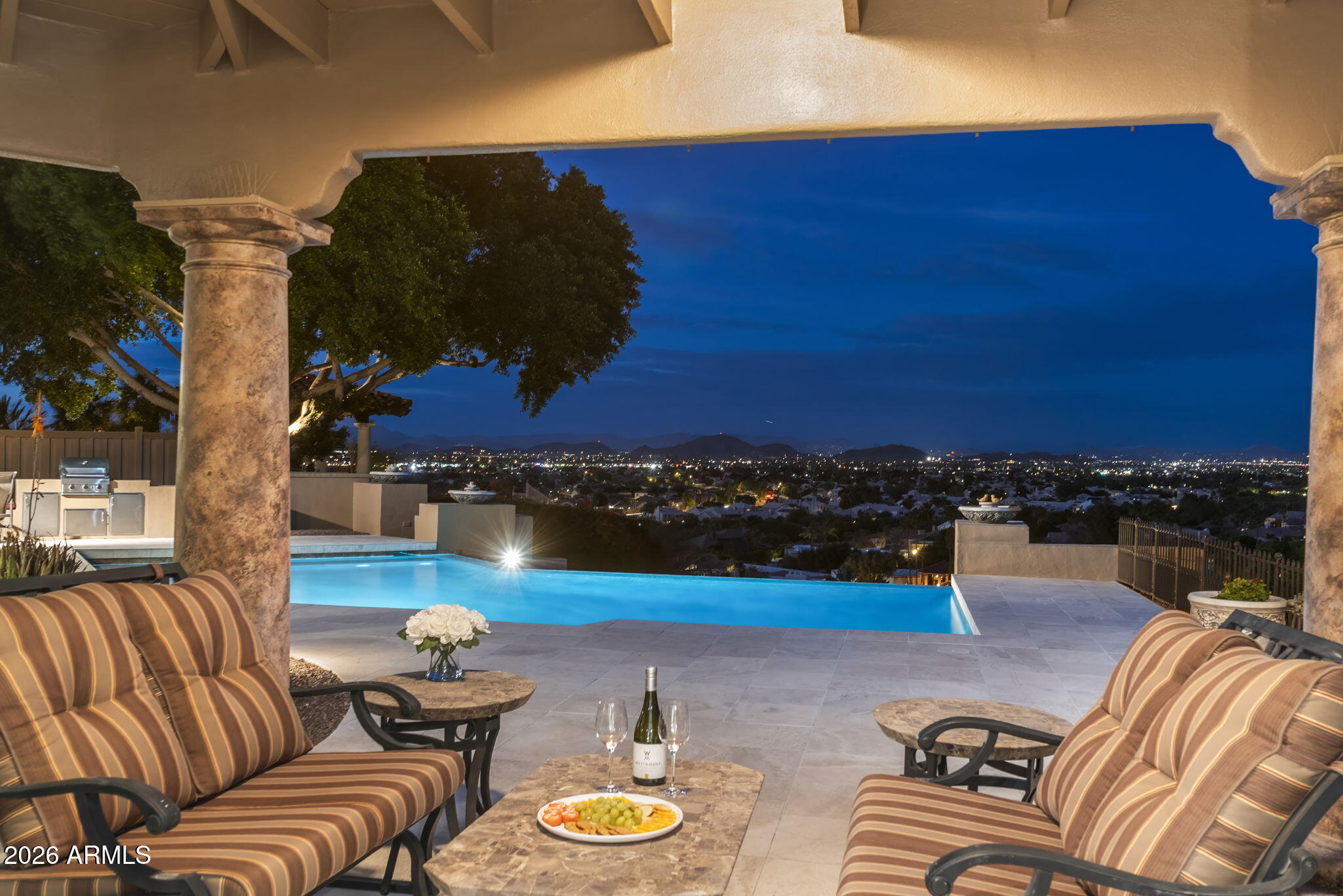 Set within the guard-gated enclave of Coral Gables Estates this elevated hillside manor captures a rare convergence of mountain silhouettes, glowing city lights & extraordinary sunrises & sunsets. Infinity-edge pool merges into horizon creating a true resort experience w/terraces, fire features & multiple view patios. Elegant interiors offer stone flooring, coffered ceilings & designer lighting. Home includes 6 Ensuite BR & Baths. Chef's kitchen w/Neff cabinetry & professional appliances opens to view-filled breakfast room. Defined by its ever-changing canvas of sky - fiery sunrises/sunsets, soft morning light & sweeping mtn views, this Coral Gables Estates ''WOW'' manor  delivers your move-in ready luxury experience, seamlessly blending Arizona's unparalleled indoor/outdoor Lifestyle MORE Capturing panoramic mountain, city light and sunrise/sunset views, this PRIVATELY-GATED Estate within the 24-hr. Guard Gated Coral Gables Estates provides both elegance & a central location. 6BR/6BA (5 of the 6BR are Ensuite).

Affectionately called, "The WOW House", it has been thoughtfully updated to perfection. Significant recent upgrades enhance comfort, efficiency and value. These include Andersen windows, new roof underlayment, new customized skylights, new luxury flooring, refreshed baths, HVAC, irrigation, exterior enhancements and more. 

Property Upgrades & Improvements
Interior
" New Andersen windows (2022 & 2025; some remaining; prior owner replaced a few)
" 2025: Reroof home
" 2025: New roof underlayment 
" 2025:  Roof installation of new tiles as needed
" 2025: Two new skylights
" 2025: New luxury vinyl flooring replacing carpet
" 2026: Travertine cleaned, restored, and polished (interior & exterior)
" Primary bathroom shower remodeled
" Two bathrooms updated with new flooring, cabinetry, and countertops
" GE Advantium speed oven
" Laundry room tile wall added
" Interior paint in several rooms
" Updated sink filtration systems
" Owned monitored security system (SAFE, 24/7 quarterly service)
" Transferrable termite warranty conveys                         

Exterior
" 2026: Pool upgraded with new LED lighting
" Trane air handler & condenser replaced (~2 years ago; 4 total units, serviced biannually)
" 2026: Exterior paint
" 2025: New irrigation system with updated timer
" BBQ island upgraded with stainless steel components
" 2025: Water heater replaced; second unit replaced previously; two Moen monitors added
" 2025-2026: Hot water recirculators replaced
" Two primary bedroom privacy/security shutters replaced
" Trex privacy fence added

Pool Table & accessories, some patio furniture & firepit convey with the home.

Medical & healthcare professionals will appreciate this close proximity to hospitals & healthcare campuses. 

Minutes from worldclass shopping, dining, hiking, arts & all that Greater Phoenix/Scottsdale have to offer. Moments from Moon Valley Country Club with a golf course, pool, tennis facilities, and dining.

A pleasant drive to Prescott, Sedona, Flagstaff, Tonto National Forest, Lake Pleasant, Bartlett Lake, and so much more. 

Fabulous schools of all kinds, including Charter, Private, Montessori, College Prep and more...

Call for your private Tour today and prepare to be WOWed!