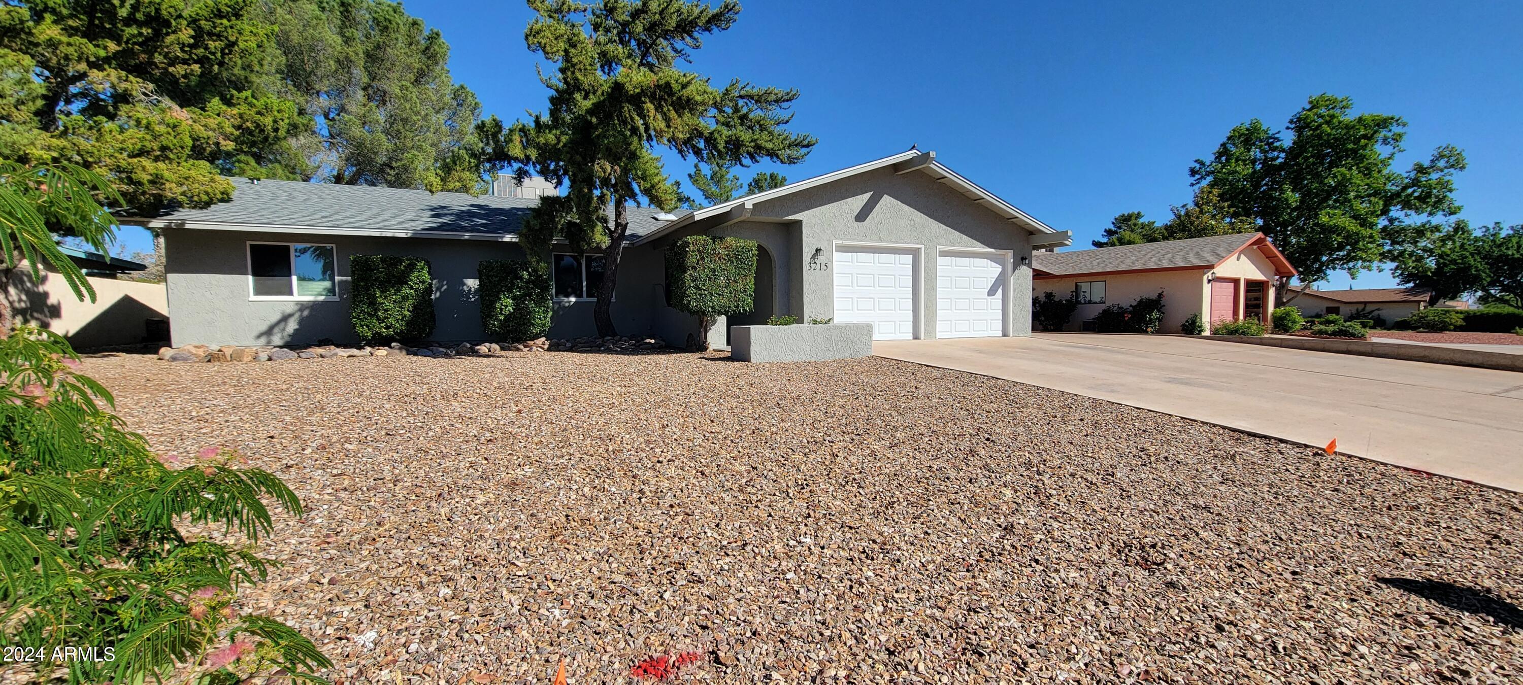 You will absolutely love this home! The home has a wonderful floor plan! There is a large living room with a real fireplace, I large dining area off of the kitchen and a large AZ room/family room off the back of the house. The bedrooms are nicely sized and you will see all of the updates and you go through the home. The kitchen has beautiful stainless appliances and lovely natural light. There is also a good sized breakfast bar. The master suite is lovely with a private entry to the backyard, dual closets, dual vanities and a walk in shower. You will love the new roof, dual pane windows, interior and exterior paint a,d even an outdoor shower. There is even room to park up to 12 cars on the slab parking. You will definitely want t make this your new home.