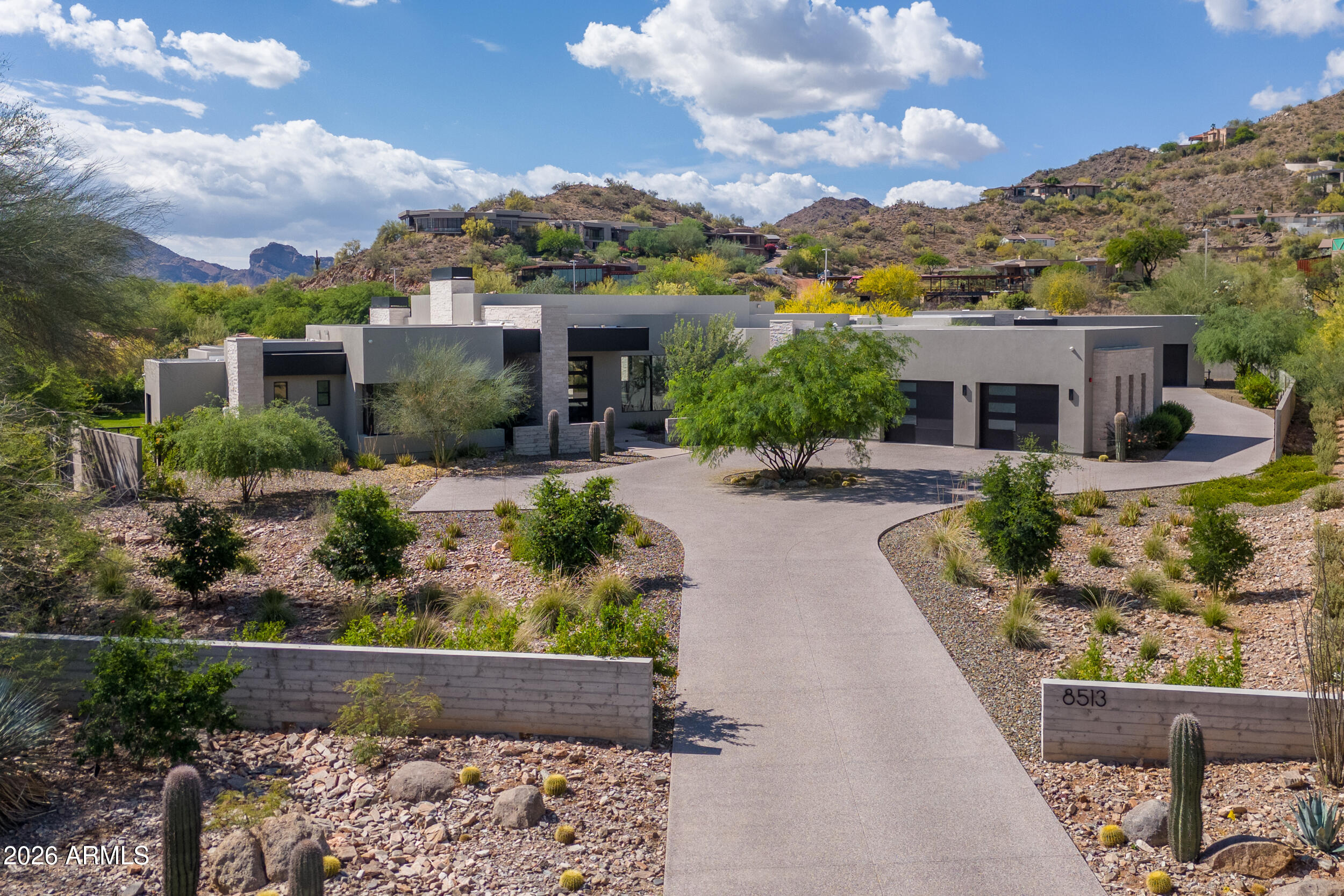 Tucked away in one of the valley's most exclusive enclaves, this luxury custom estate offers buyers the opportunity to experience refined desert living in the heart of Paradise Valley.  Ideally situated on a quiet cul-de-sac, this stunning newer construction home showcases a soft modern aesthetic, thoughtfully designed for the most sophisticated buyer.

The main residence spans over 5,000 square feet, offering 4 spacious bedrooms, 4.5 bathrooms, a dedicated game room and a 3 car garage.  Enjoy a meticulously designed open concept featuring expansive windows and doors, filling the home with natural light.  Telescoping doors highlight the mountain views and create the ultimate indoor/outdoor lifestyle Arizona is known for.
Complementing the main home is a beautifully appointed 1,360 square foot guest house, complete with 2 bedrooms, 2 bathrooms and it's own 2 car garage - perfect for extended family, guests or a private retreat.
Step outside to your own backyard oasis, where breathtaking views of Mummy Mountain provide a dramatic and serene backdrop.  Whether entertaining friends and family or enjoying quiet evenings, the setting offers both privacy and unparalleled beauty.
Located in one of the Valley's most prestigious neighborhoods, this home delivers the perfect balance of modern elegance, functional design and iconic Arizona scenery.

Conveniently located near everything!  Minutes from Old Town Scottsdale, Talking Stick, Kierland Commons, the Scottsdale Quarter, Biltmore Fashion Park and Scottsdale Fashion Square, offering upscale shopping, five-star dining and more!  For golf lovers, you are surrounded by world-renowned courses, including the TPC Scottsdale, home of the Waste Management Open.  For outdoor enthusiasts, you are in close proximity to Camelback Mountain, Piestewa Peak and the McDowell Mountain Preserve, where you can enjoy miles of hiking, biking and horseback riding.
Whether you are searching for a primary residence, vacation home or executive home for entertaining, this property offers everything you could ask for.  What a great place to call home!