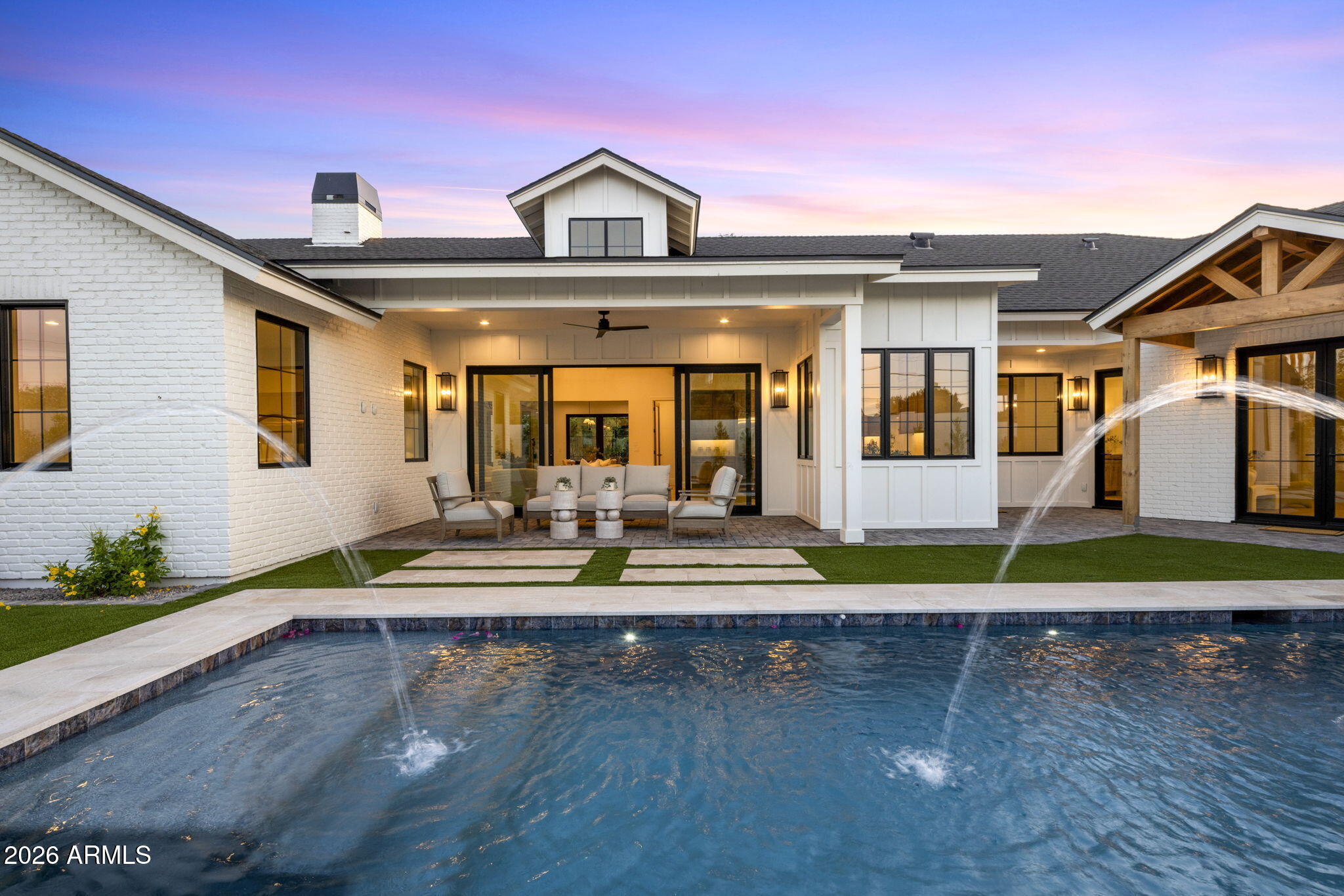 Set in the heart of Hacienda Granada, this new construction single-level modern farmhouse brings together the best of Arcadia living with Camelback Mountain views, a larger 12,841-square-foot lot, and a location that feels connected to everything people love about the neighborhood. The 5-bedroom, 5.5-bath floor plan was designed with real livability in mind, offering a thoughtful split-bedroom layout along with a bonus living room, private office, and gym that give the home flexibility for work, guests, and everyday life. Inside, European oak flooring, hickory cabinetry, designer lighting, and elevated finishes create a warm, polished feel without losing the comfort of home. The kitchen, anchored by Wolf, Sub-Zero, and Cove appliances, opens naturally to the main living space, making the home feel equally suited for quiet mornings, family dinners, and easy entertaining. Clean lines, natural finishes, and thoughtful design allow the home to make the most of light and space throughout, creating a home that feels both refined and easy to live in. Located in the Hopi School District and just moments from LGO, Kachina Park, The Global Ambassador, and more, this home offers the kind of Arcadia lifestyle that is hard to duplicate.