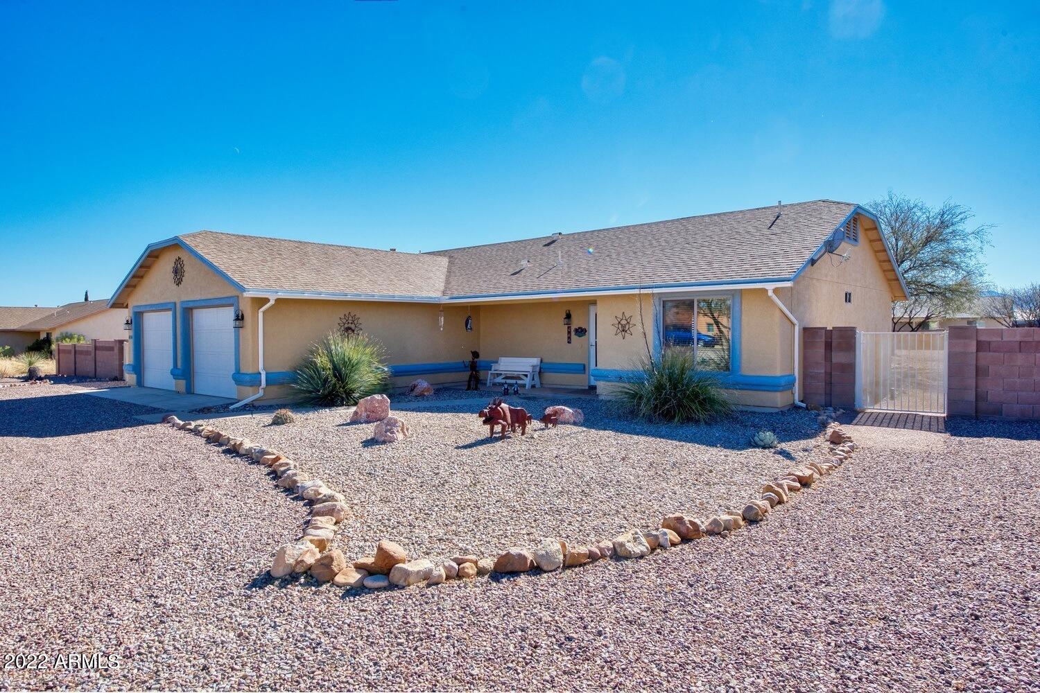Super cute 3 bedroom 2 bath split floor plan on .713 acres with a fully fenced block wall!  This 1541 sf home has been shown obvious tender loving care.  Newer wood look plank laminate floors, dual pane windows, newer interior and exterior paint, and oversized DEEP 2 car garage.  If you are looking for some space on a paved road, this could be the one!  All rooms have been wired and braced for ceiling fans throughout.  Covered and uncovered patios offer hours of outside entertaining.  RV parking, and RV gate.  This home won't last long, so call today to schedule your private showing!
