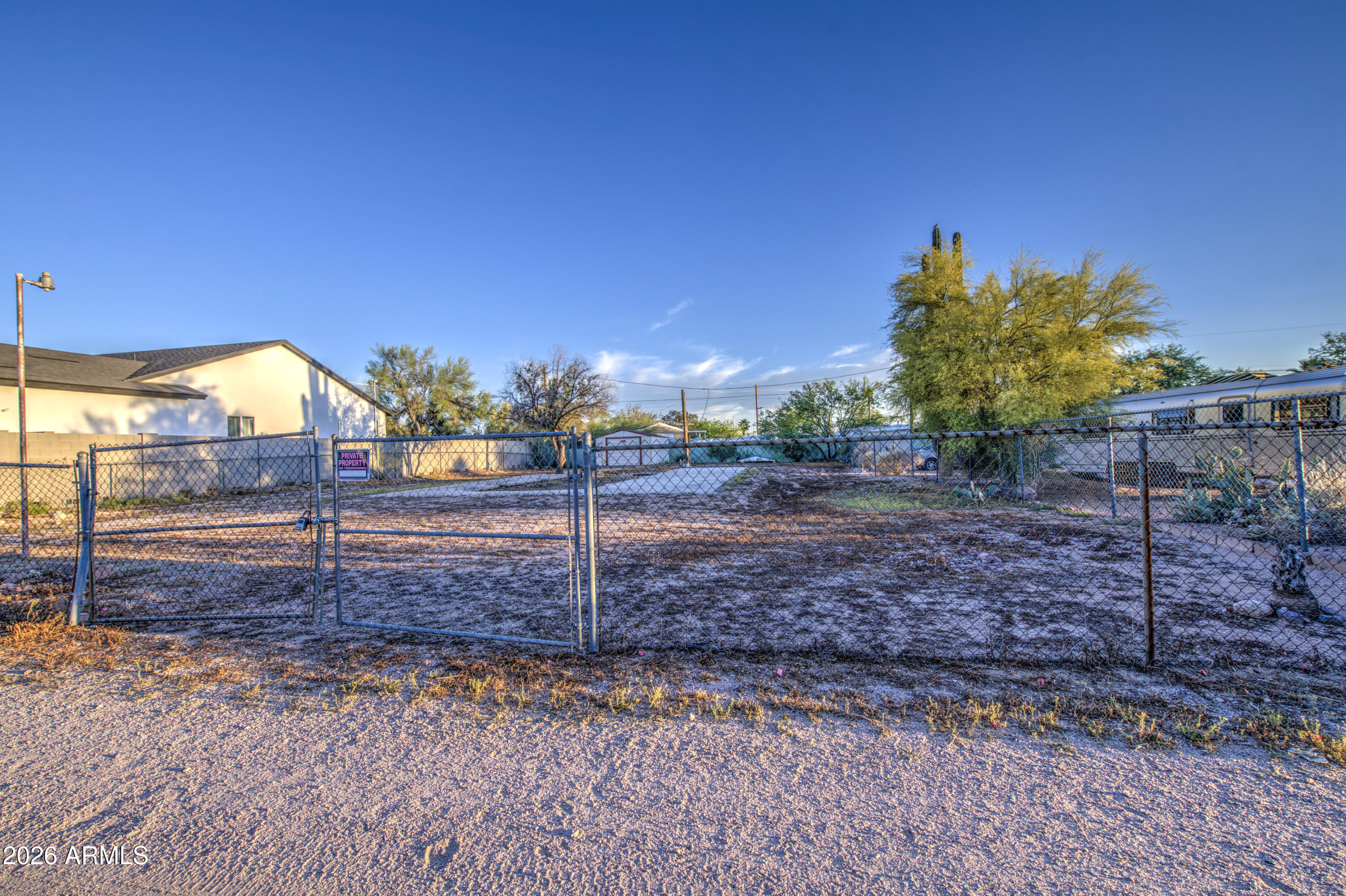 Great level, lot ready to build your dream home or ready to set new mobile on. Located on private street. Views of Superstitions. Metal shed 14x20 on cement slab.  Fully fenced.