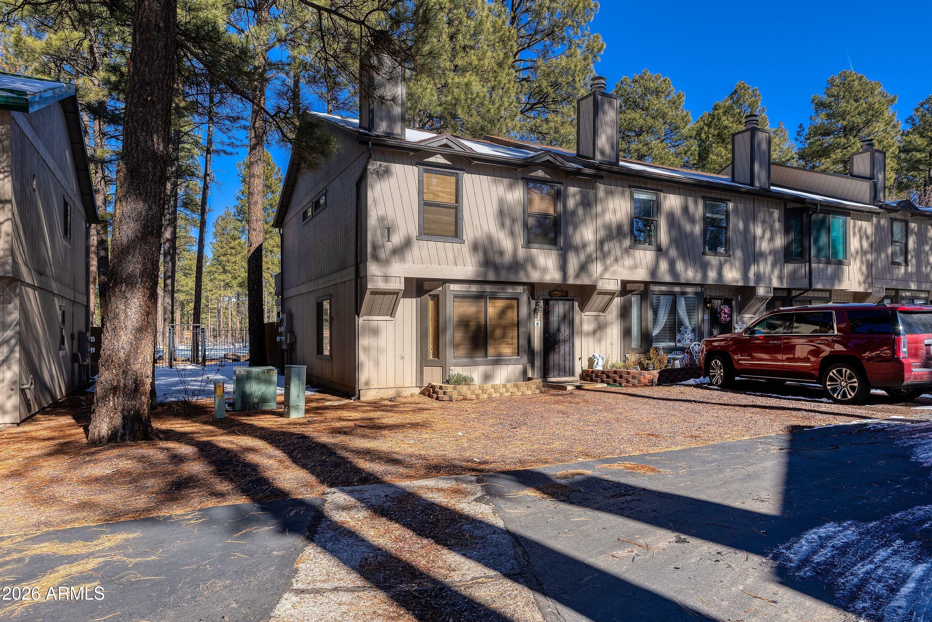 BACKING DIRECTLY TO THE FOREST, this home provides exceptional privacy and a serene natural backdrop rarely found in townhome communities. Beautifully positioned 2-bedroom, 2.5-bath end-unit townhome offers 1,337 sq ft of mountain living at its best. The open and functional floor plan features spacious living areas, ideal for both full-time living and a lock-and-leave mountain retreat. Each bedroom includes its own ensuite bath, while the additional half bath adds convenience for guests. Large windows invite in natural light and frame peaceful forest views, creating a true connection to the outdoors. As an end unit, enjoy added windows, enhanced privacy, and a quiet setting. Step outside to the forested backdropperfect for morning coffee, wildlife watching, or easy access to nearby trails. Located in the heart of Pinetop, this home offers cool mountain summers, four-season enjoyment, and proximity to dining, shopping, recreation, and outdoor adventure.

Whether you're seeking a primary residence, second home, or investment opportunity, this forest-backed end unit delivers comfort, privacy, and the mountain lifestyle you've been waiting for.