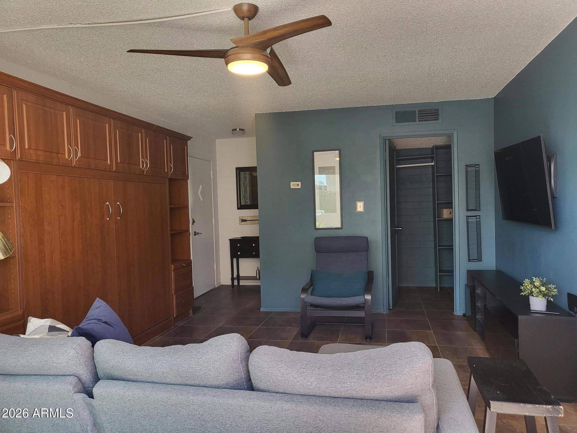 Gorgeous, Move-in ready, fully remodeled & furnished ground floor studio! Close to ASU with easy access to entire Valley. Incredible kitchen: Quartz counters, pantry, double sinks, soft close/pull out cabinets, high end appliances: Induction Range, Microwave is convention oven & air fryer too, European refrigerator & Deluxe exhaust fan. Double pull out Murphy Bed with storage, 20'' tile throughout, Dual Pane window & slider door to private furnished patio. Close to pool, mail & parking. Coop is cash only, fast & easy board & credit approval done. No rentals, assisted/comfort animals only. $349 monthly covers: taxes, blanket insur, water, full repair of roofs, a/c & heating units, water heater, electrical & plumbing in walls, 4 pools, 4 laundry, exercise, library & meeting rooms. Near 101 & 202 freeways, ASU, Tempe Marketplace, shopping, parks, bus stop & free Scottsdale Trolley. Perfect for students, winter visitors or just wanting maintenance free living in the heart of Scottsdale!