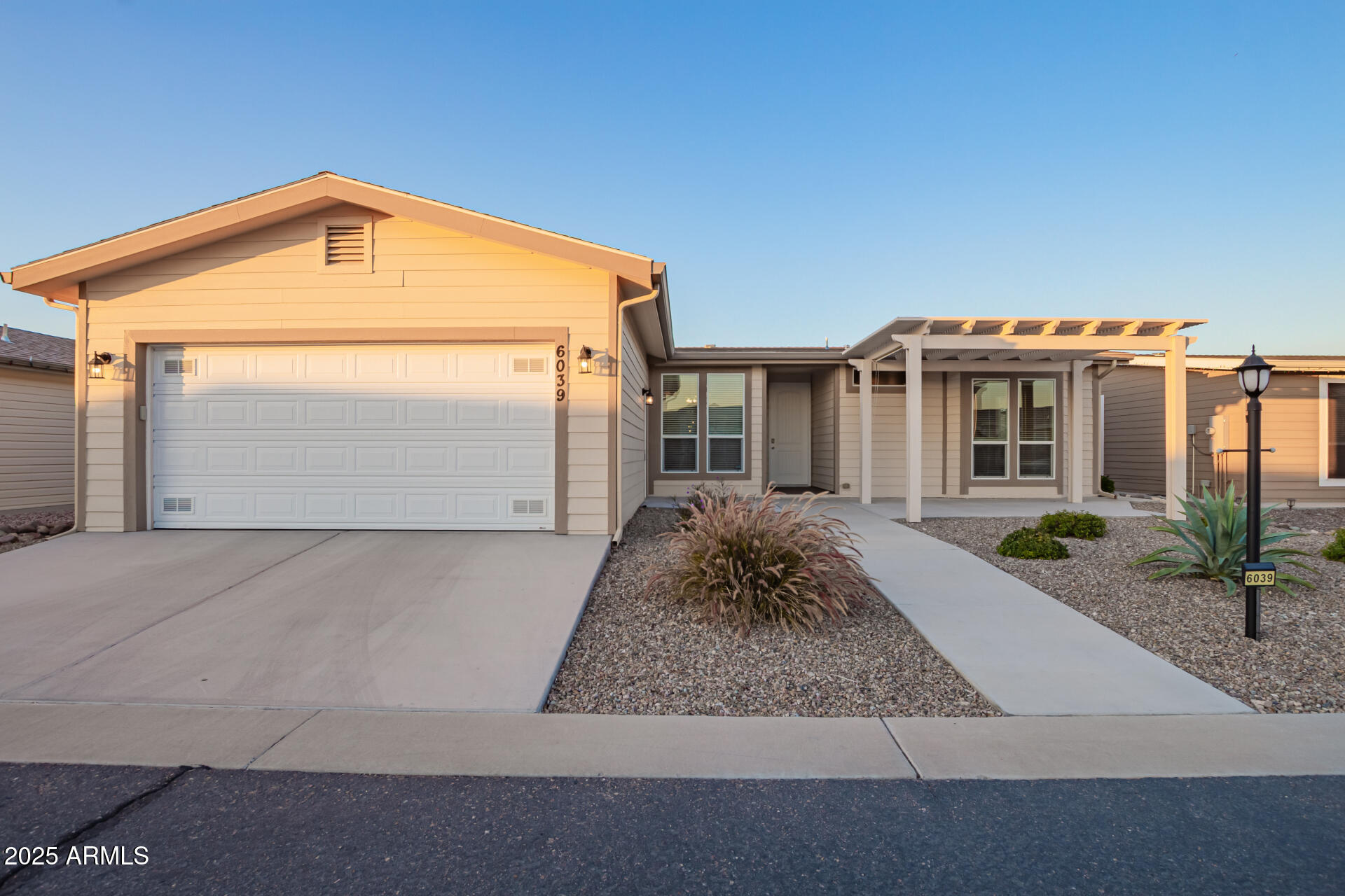 2021 Build • Superstition Mountain Area • Near Banner Goldfield Medical Center

Located in the gated 55+ Dolce Vita community, this 2021-built home offers resort-style living near the Superstition Mountains, Goldfield Ghost Town, Lost Dutchman State Park, Canyon Lake, and the scenic Apache Trail. The open-concept floor plan features 3 bedrooms, 2 baths, approximately 1,600 sq ft, and a 2-car garage. Recent 2022 upgrades include quartz countertops, updated appliances, and modern kitchen finishes. Enjoy outdoor living from the screened Arizona room and custom front pergola. Community amenities include a 33,000-sq-ft clubhouse, heated pool and spa, fitness center, pickleball and tennis courts, dog park, and year-round social activities. Conveniently located near shopping, dining, healthcare Mediterranean-style clubhouse with a ballroom, fitness center, library, billiards, card and craft rooms, plus a heated pool, two spas, tennis and pickleball courts, and a full calendar of social activities.