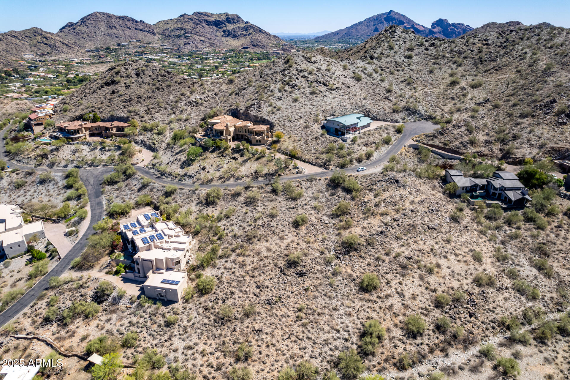 Breathtaking panoramic views await you from this Hillside Paradise Valley lot! Enjoy unobstructed city lights to the North and East, with stunning vistas of Troon and Pinnacle Peak. Nestled in a quiet cul-de-sac, this premium lot offers nearby access to hiking trails in the Phoenix Mountain Preserve, & numerous shops and restaurants. A rare opportunity to build your dream home with sweeping views and natural beauty all around you, in Sunset Hills; one of the best values for a hillside lot! 
Architectural rendering is of a previously proposed home concept for this lot. Home is not included.  Buyer may select any architect or builder.