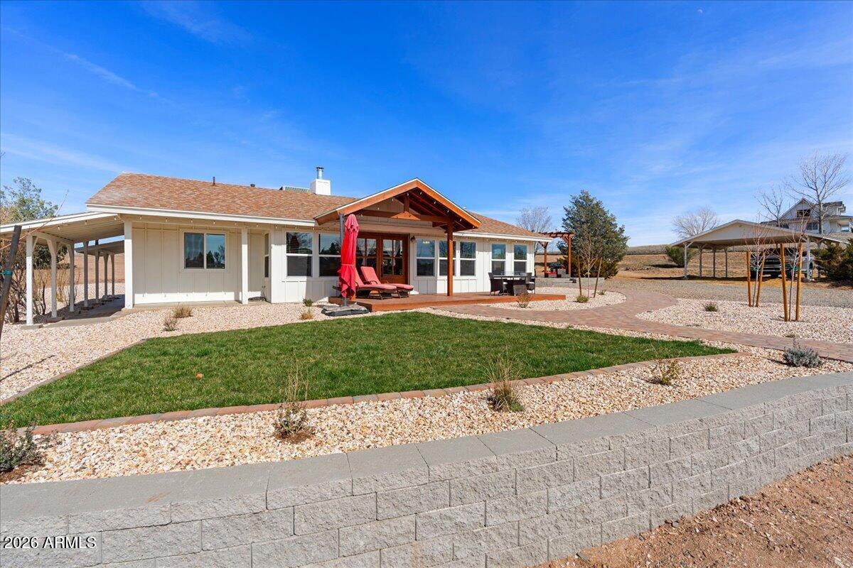 Just a short drive from downtown Prescott, this beautifully renovated 4-bedroom, 2-bath home offers the perfect blend of privacy, convenience, and breathtaking views. Inside, the home is light, bright, and open, featuring an impressive 800-square-foot great room and a desirable split floor plan. The large primary suite offers comfort and privacy, while the full gut renovation--just completed after a meticulous two-year project--brings modern updates throughout. Approximately $250,000 in improvements include a newer roof (3 years old), central heat and air conditioning (4 years old), and all appliances just 2 years old. Tucked away at the end of the road with no through traffic, you'll enjoy peaceful surroundings just ½ mile from pavement and only 1 mile to Safeway, the post office, restaurants, and everyday amenities of Chino Valley. Set on 2.8 usable acres, the property showcases stunning Granite Mountain and pastoral views, gorgeous landscaping with maple trees, and a drip irrigation system. Outdoor living is a dream with a spacious deck and massive patio complete with a gazebo, perfect for entertaining or simply relaxing in the quiet neighborhood setting. Equestrian-ready and fully fenced with no-climb perimeter fencing for dogs and horses, the property is cross-fenced with barbless wire and includes a 24' x 24' barn, 12' x 12' tack/feed room, round pen, and 2 acres of horse pasture (up to 5 horses permitted). A carport conversion to a garage has been estimated at approximately $20,000.