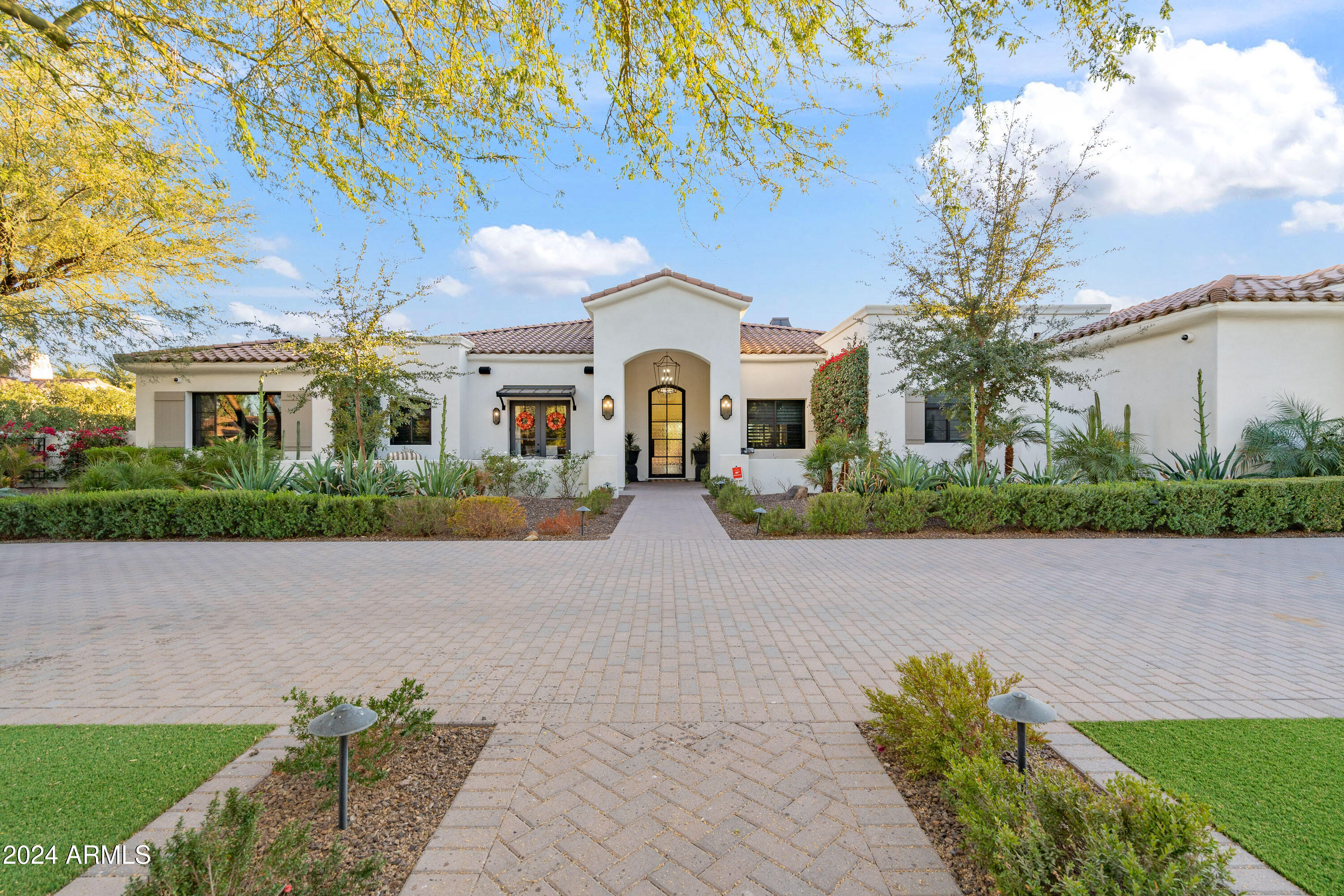Stunning single level home first time to re-sale market! This 6 bedroom, 6.5 bath home defines an active entertaining lifestyle, both inside & out.  The private, professionally designed North/South backyard boasts mountain views, a sparkling pool & spa, outdoor kitchen, with 3 cooking appliances, 2 fridges, 3 large seating areas, fire table, fire features, bar, pickleball , basketball , Bocci Ball & pool bath. Ctrl4 audio, $50,000 system inside and out, security system. Open floor concept design living, hardwood large plank oak flooring, beautiful lighting fixtures. Living Room opens to outdoor patios .Dream kitchen with top of the line kitchen appliances. Quartz  countertops, three dishwashers . Miele built in coffee maker, Subzero fridge, Wolf gas 6 burner stove. Attached Casita wing with outside entrance a separate living room with kitchen, 2 dishwashers, two fridges and ice maker, large TV, fireplace that opens to outdoor backyard entertaining and pool. Master bedroom, let's talk 2 custom closets for your designer purses and shoes. Stand alone bath tub and separate shower, dual sinks. Exquisite tile. Office has built in bookshelves, 2 desks. One bedroom, has 4 built in bunkbeds for stay overs! . Game Room, Gym has special commercial flooring. Garage, epoxy floor. A must see home for the most discriminating buyer. Office and gym. Gym could be 6th bedroom.