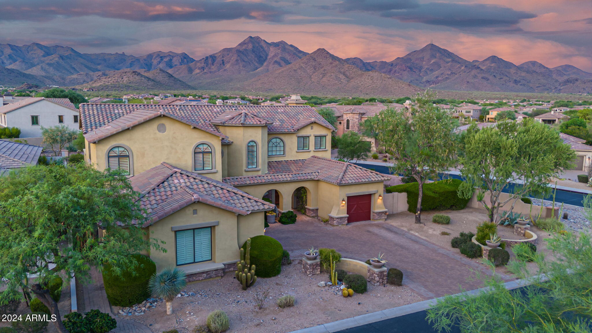 Beautiful home in one of the most sought-after neighborhoods in North Scottsdale - Windgate Ranch. This 5 bedroom, 3.5 bath plus office and game room home sits on a premium corner lot and features an open floor plan that offers a ton of functional space for a large family. Kitchen boasts Wolf and Sub-Zero stainless appliances, granite counters, large island with a separate prep sink and walk-in pantry.  Multiple French doors from the living room to the family room lead out to an incredible backyard setting with magnificent views of the McDowell Mountains, a heated salt water pool and spa, built in BBQ and water fountain, surrounded by artificial turf, lush landscaping and multiple seating/dining areas for outdoor entertaining. Large side yard offers plenty of space to add a sport court. Extended primary suite features a newly remodeled bathroom and two sets of french doors off the balcony where endless mountain views can be enjoyed. Hardwood floors, tons of built-in custom cabinets, custom lighting and fixtures can be found throughout. 
Home has been meticulously maintained and is move-in ready.
Windgate Ranch is an amazing 24-hour guard gated community with multiple community pools, clubhouse, kids play areas, tennis/pickleball/sand volleyball courts, and an interior walking path throughout.