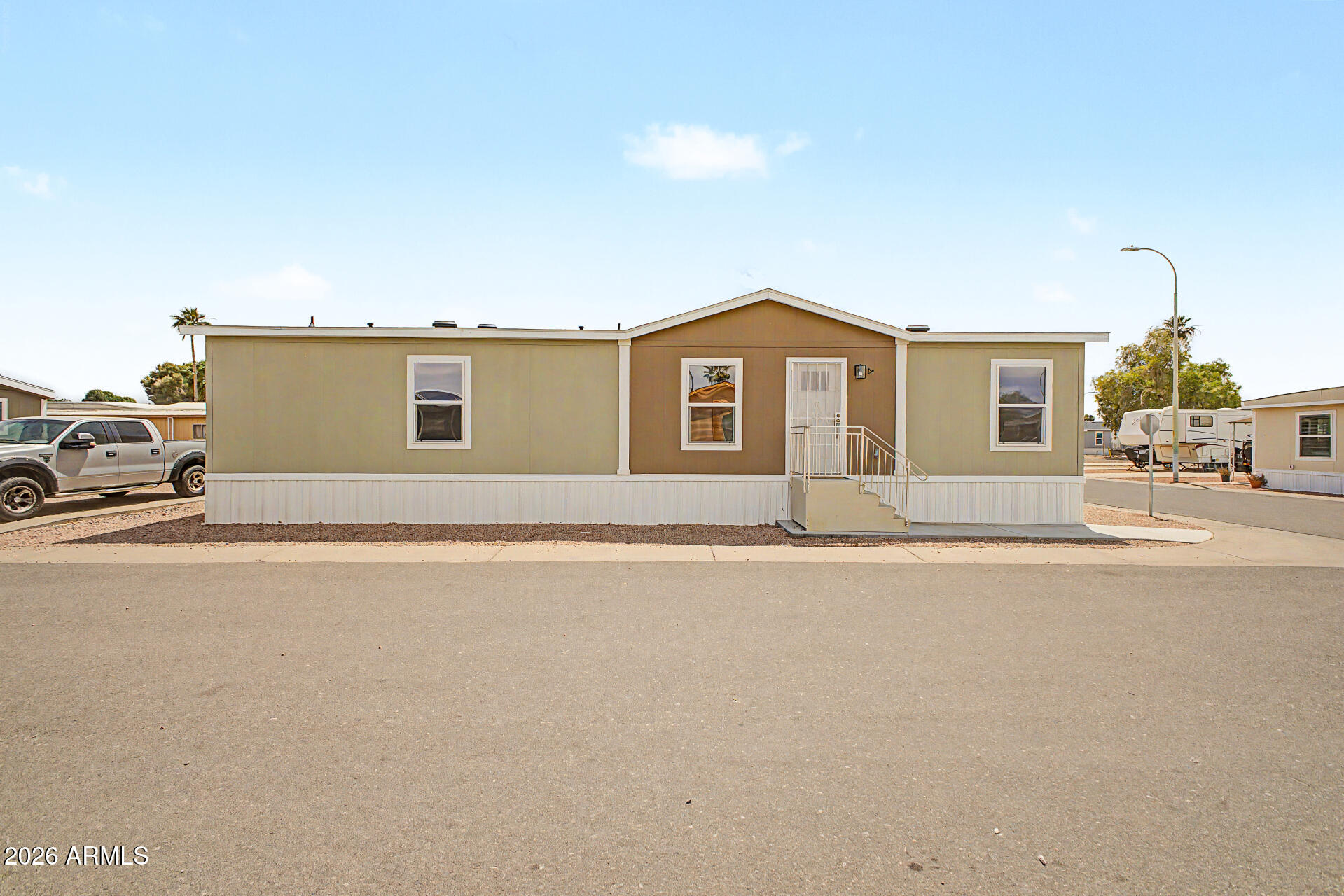 This house is perfect for entertaining with its bright and spacious rooms. The large kitchen features beautiful cabinets, large kitchen island and stainless steel appliances, perfect for creating your favorite meals. The formal living and dining rooms provide a great area to entertain family and friends. The bedrooms are spacious and perfect for any size family.  Do not miss your chance to own this Lender REO at reduced price!  Seller/Lender does finance for Home Only on leased land.